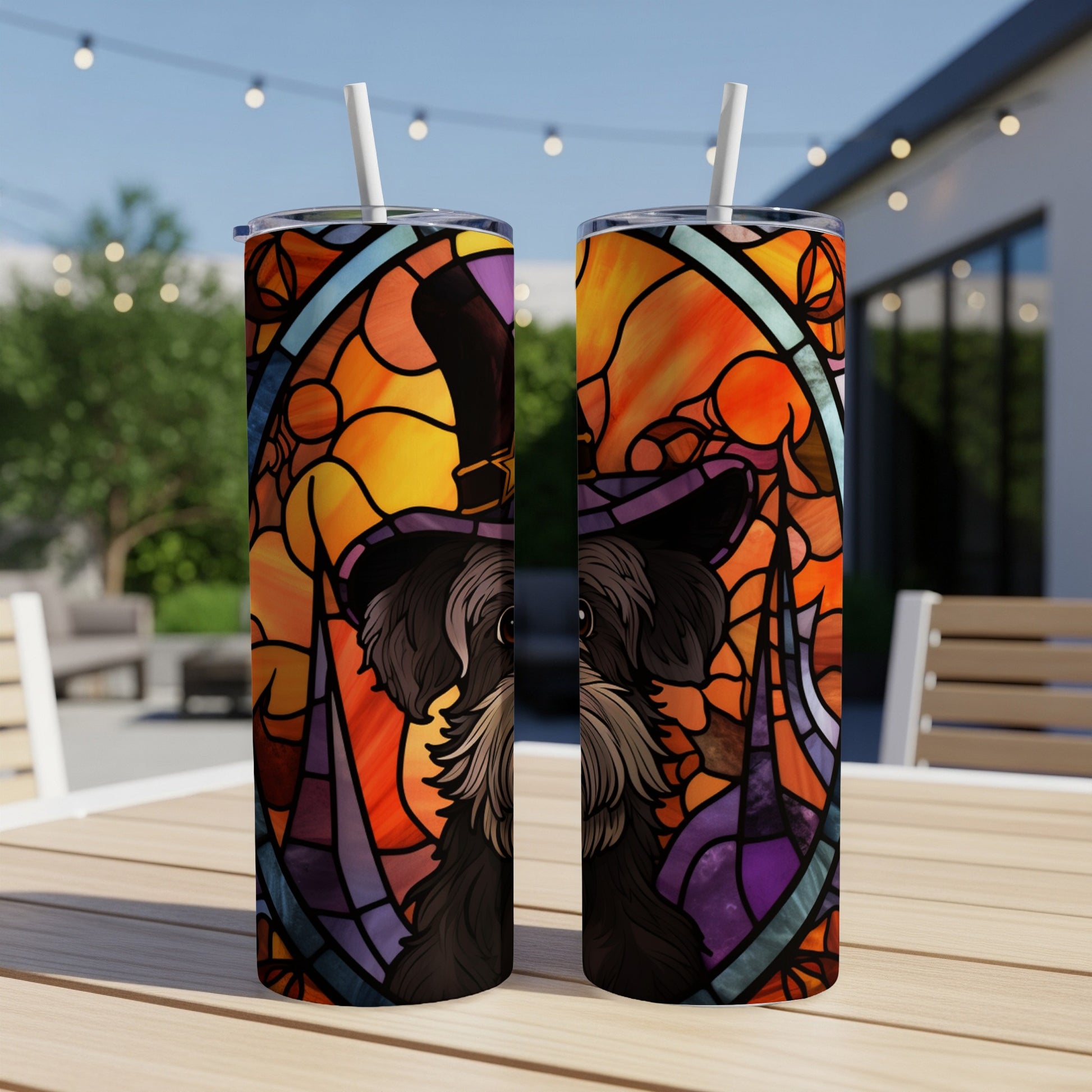 Two tumblers with stained-glass dog and witch hat design.