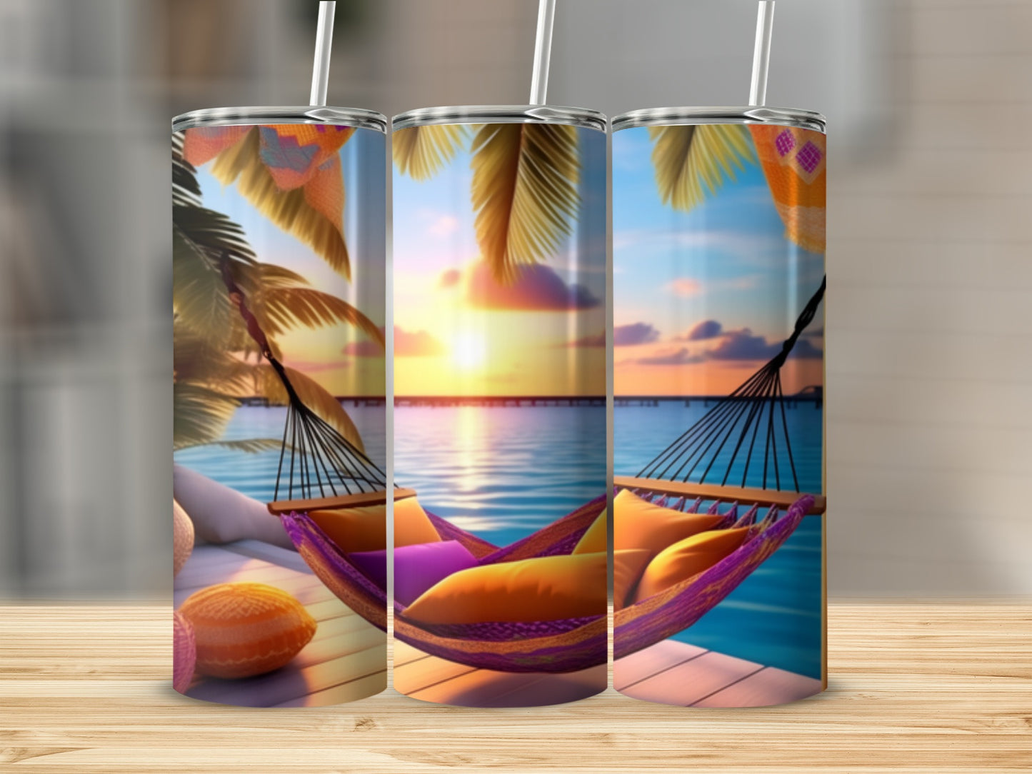 Triptych of tumblers showing a tropical sunset with a hammock.