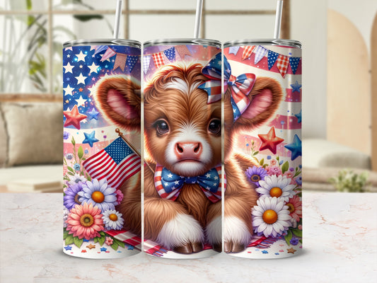 Cow with American flag, flowers, and patriotic bow on tumbler.