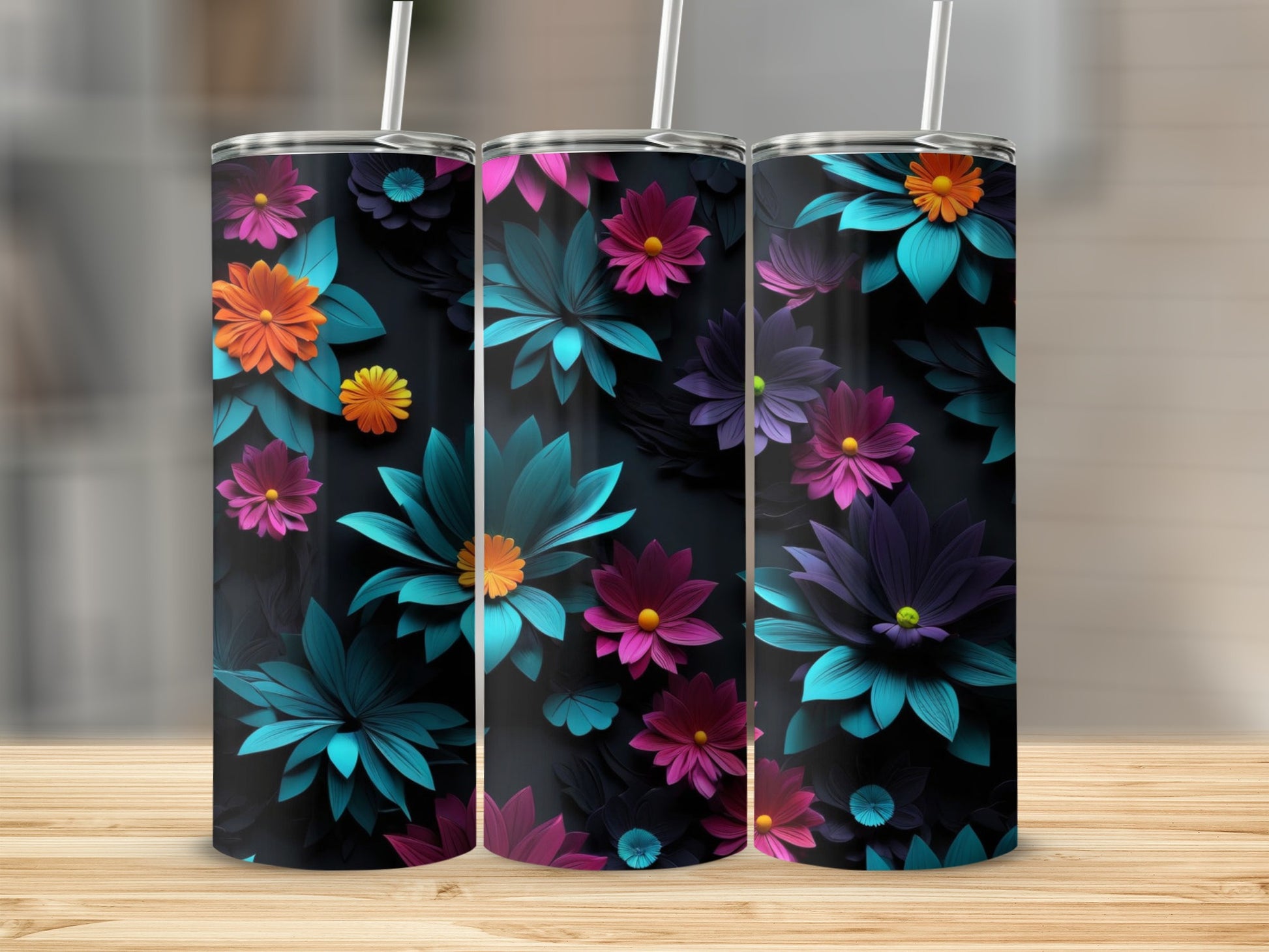 Three tumblers with a dark floral design and vibrant teal, pink, and orange accents.