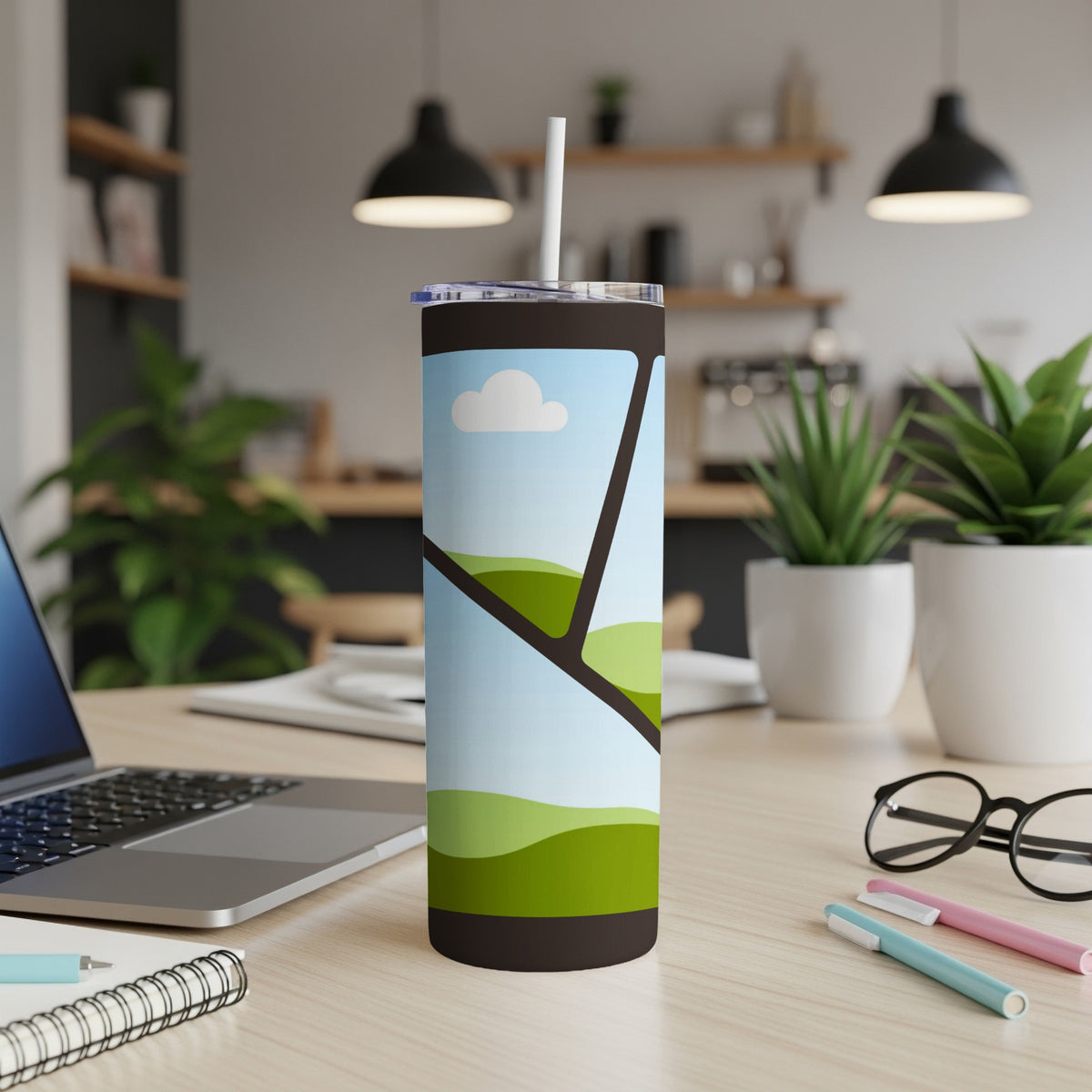 Tall tumbler with stylized landscape of rolling green hills and clouds.