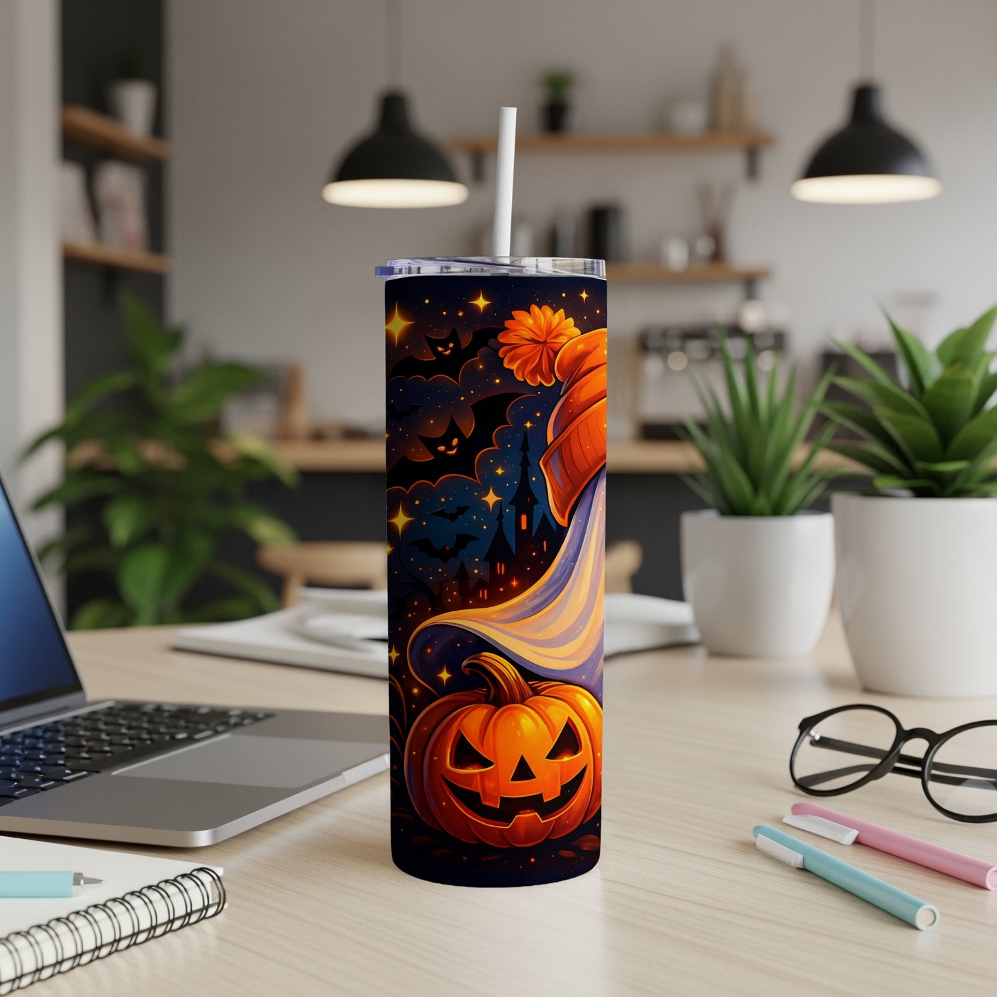 Tall tumbler with a Halloween design featuring a jack-o'-lantern, bats, and a castle.