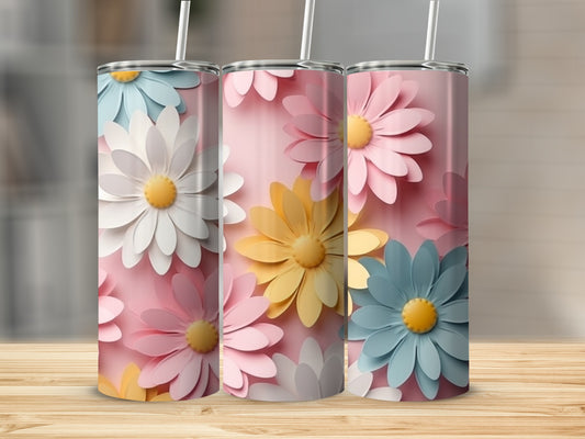 Three pink, blue, and yellow floral tumblers with white straws.