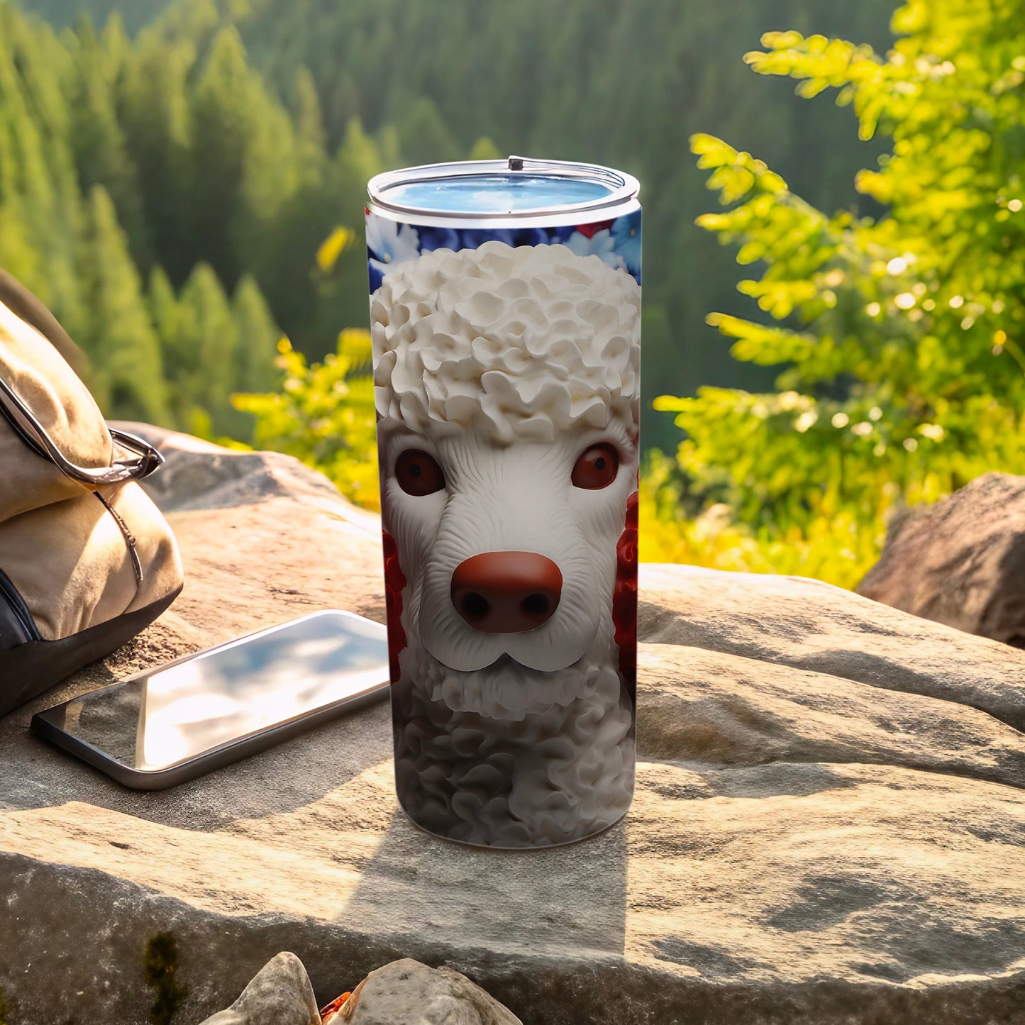 Tumbler with a poodle dog's face design on it, outdoors.