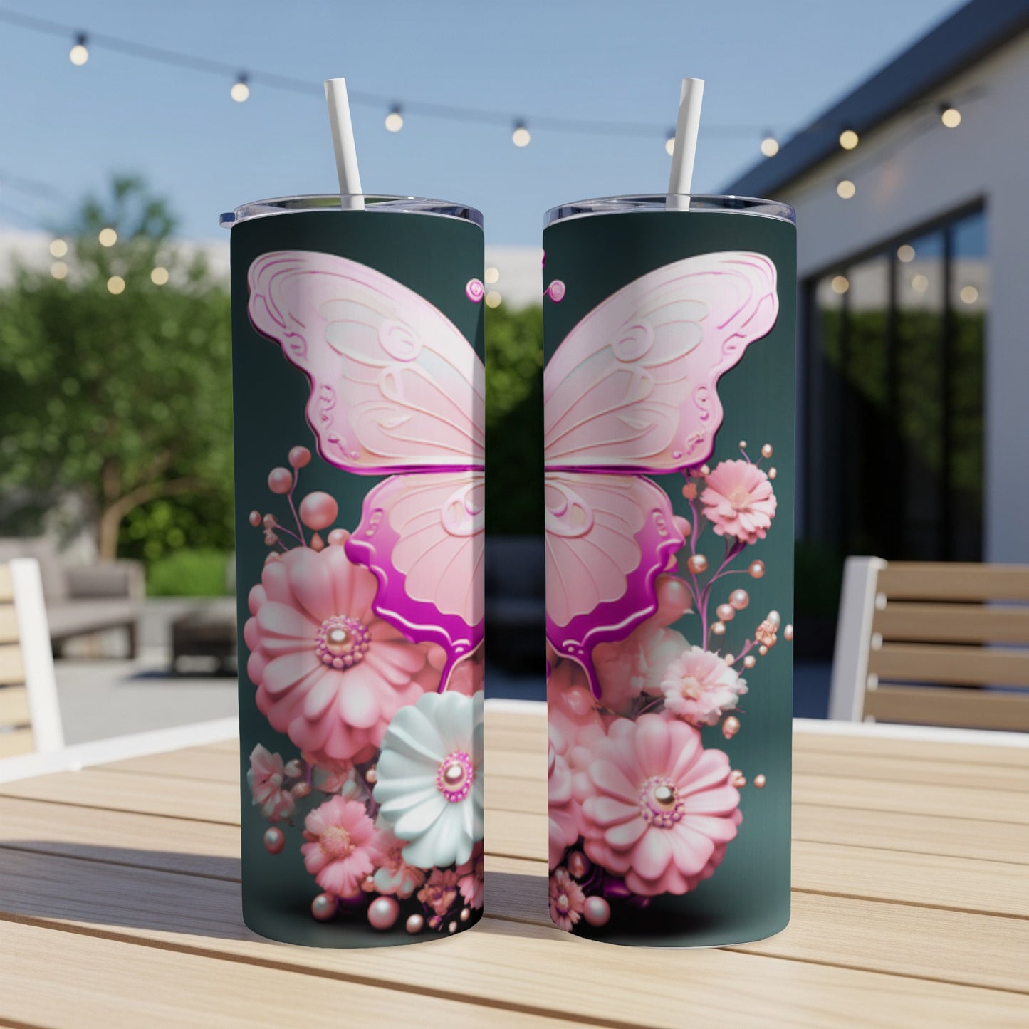 Two tumblers with pink butterfly and floral designs on a wooden table.