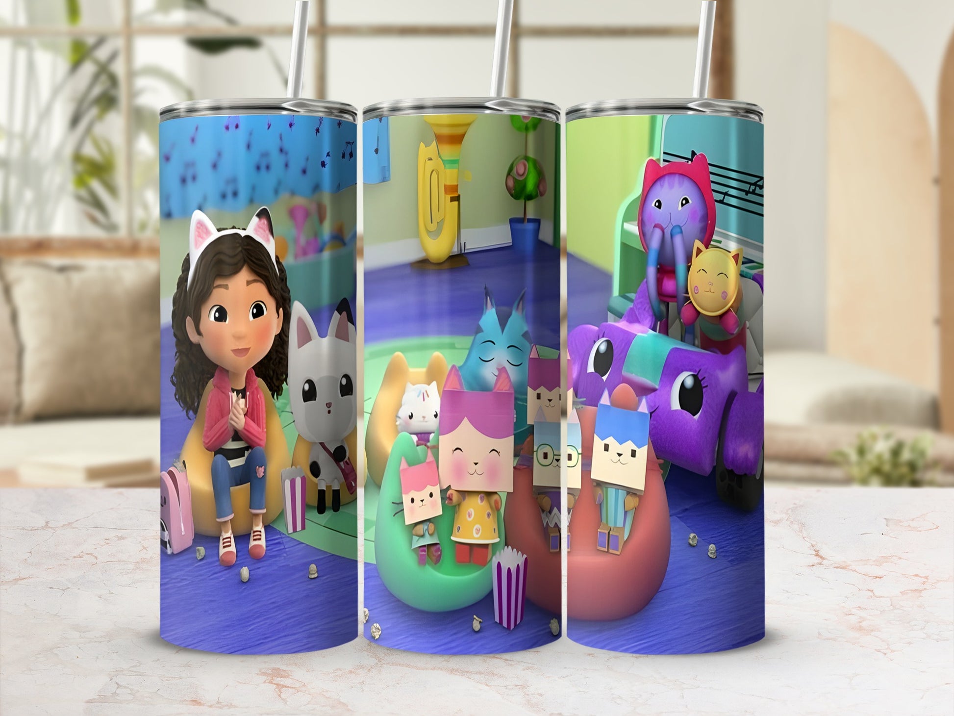 Kids' tumbler with cartoon cat characters and music notes.