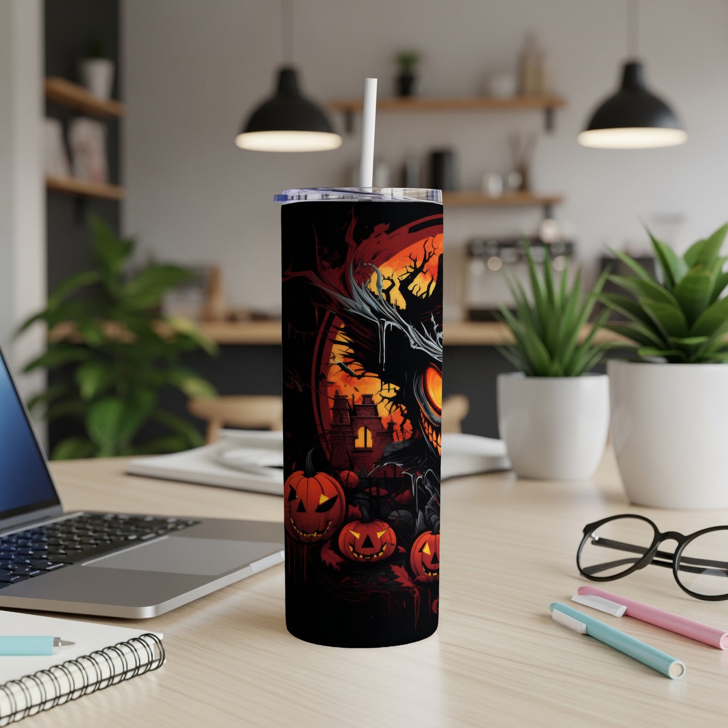 Black tumbler with spooky Halloween design featuring pumpkins, a haunted house, and a creepy character.
