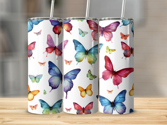 Three tumblers decorated with colorful watercolor butterflies.