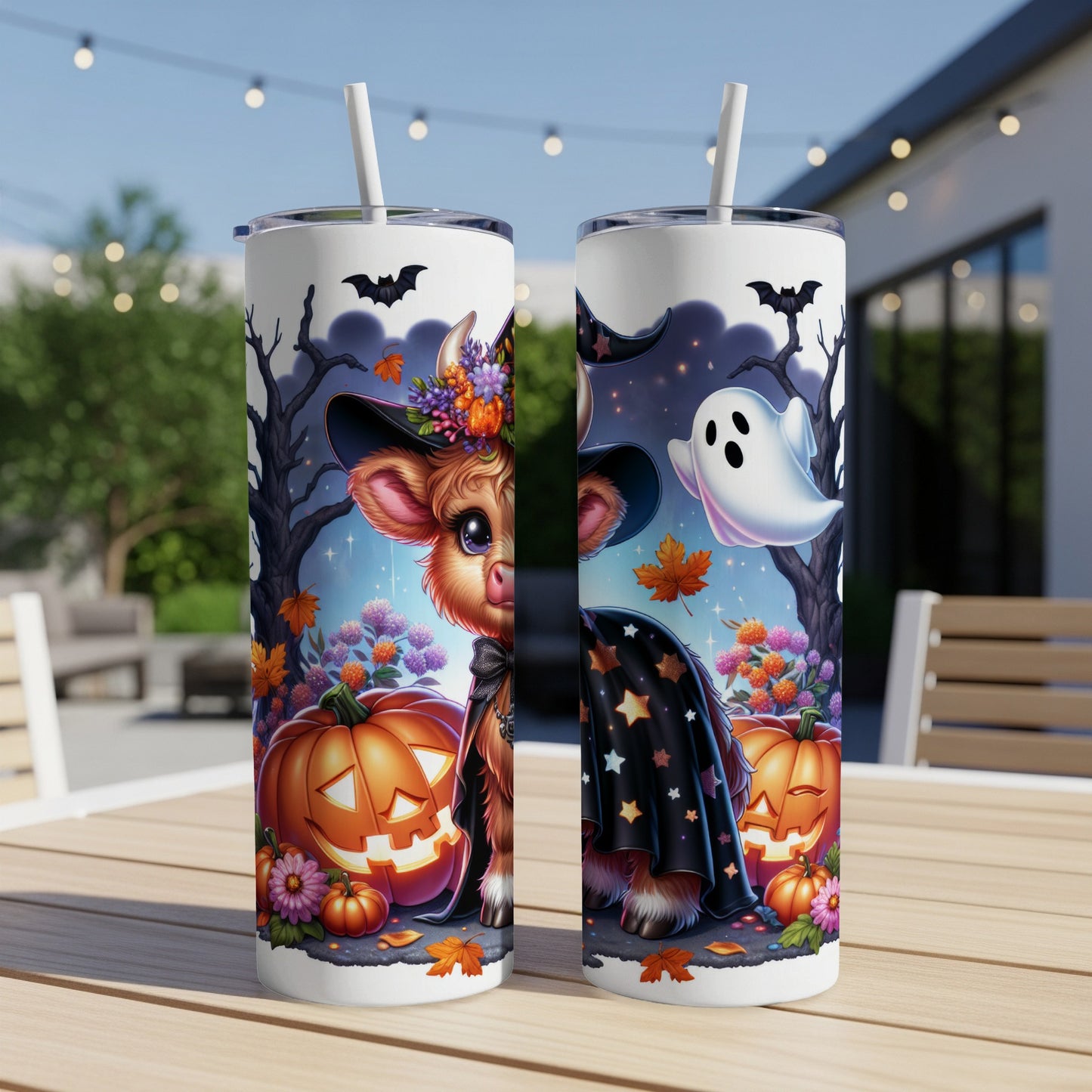 Cow wearing a witch hat and costume with pumpkins and ghosts.