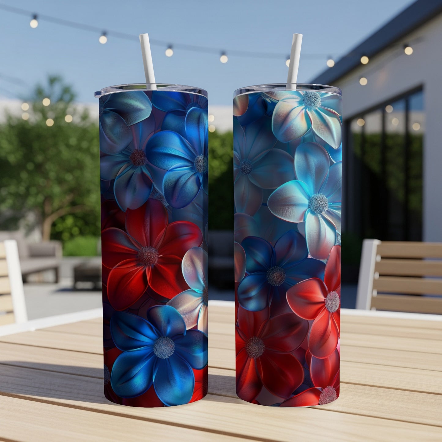 Two tall tumblers with red, white, and blue floral designs stand on a table.