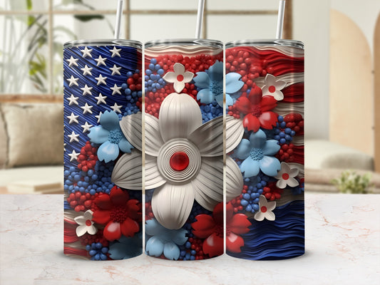 American flag tumbler with red, white, and blue flowers.