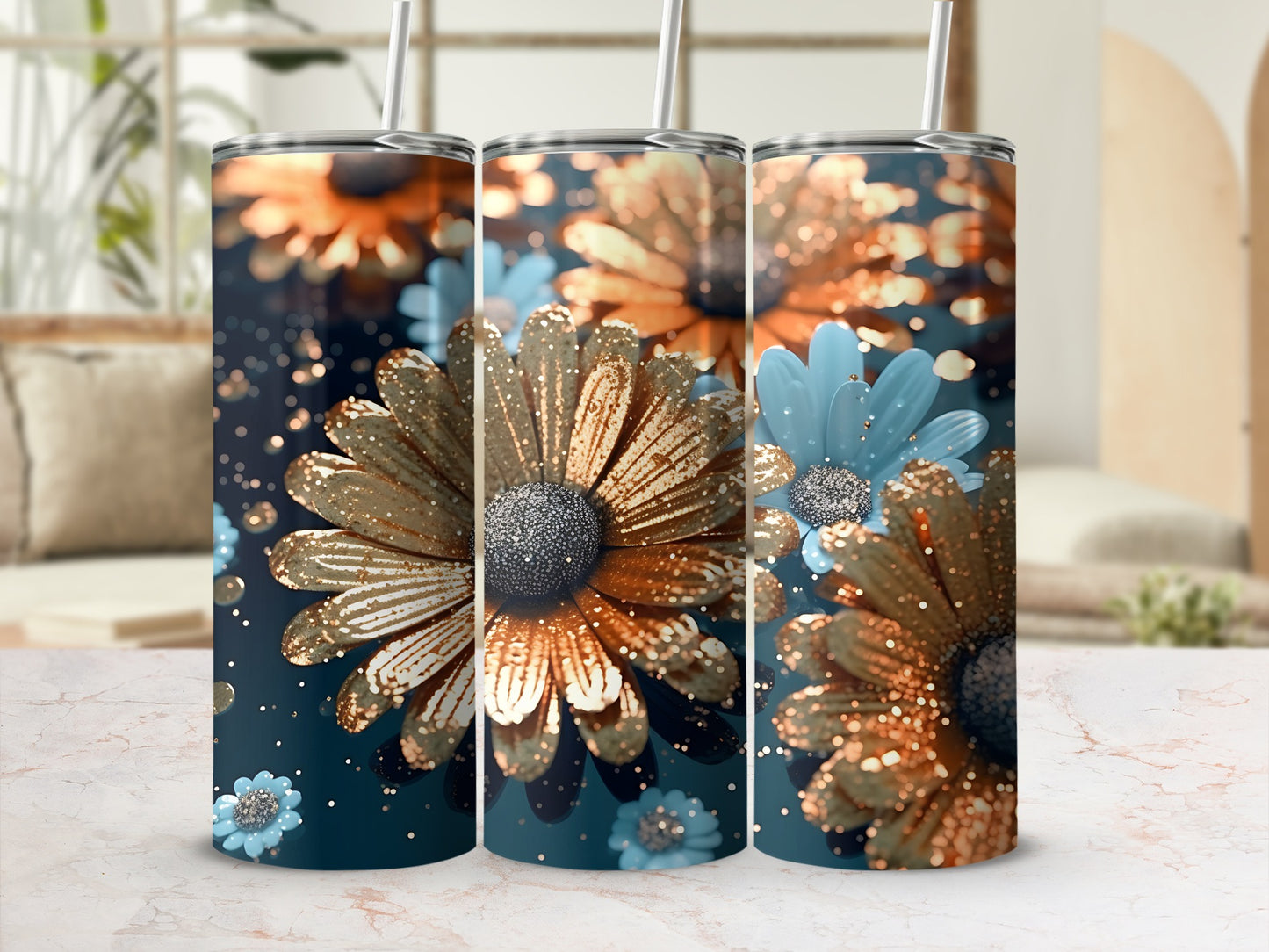 Three tumblers with glittery gold and blue floral designs.