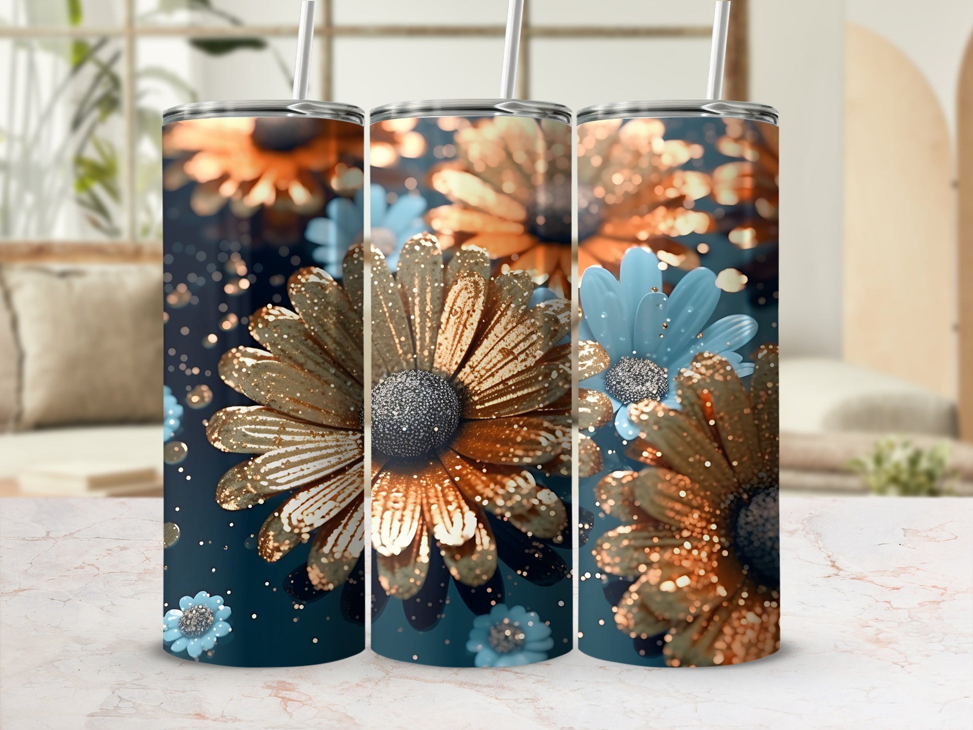Three tumblers with glittery gold and blue floral designs.