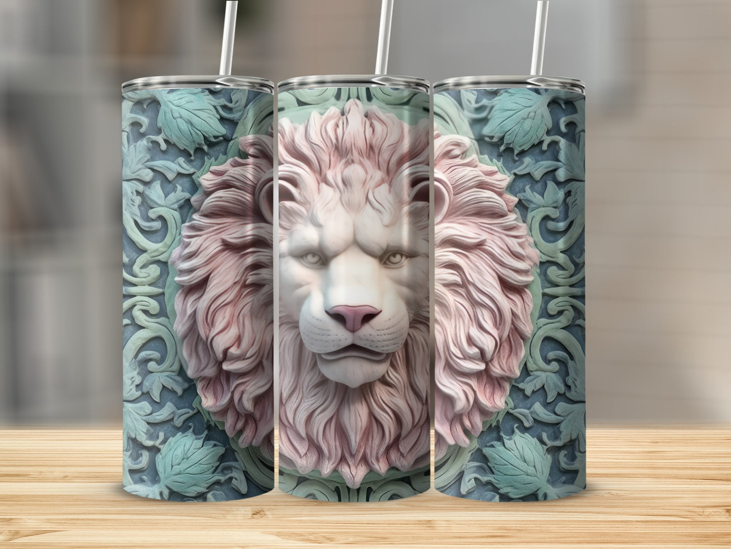 Three tumblers with embossed lion heads and floral patterns.