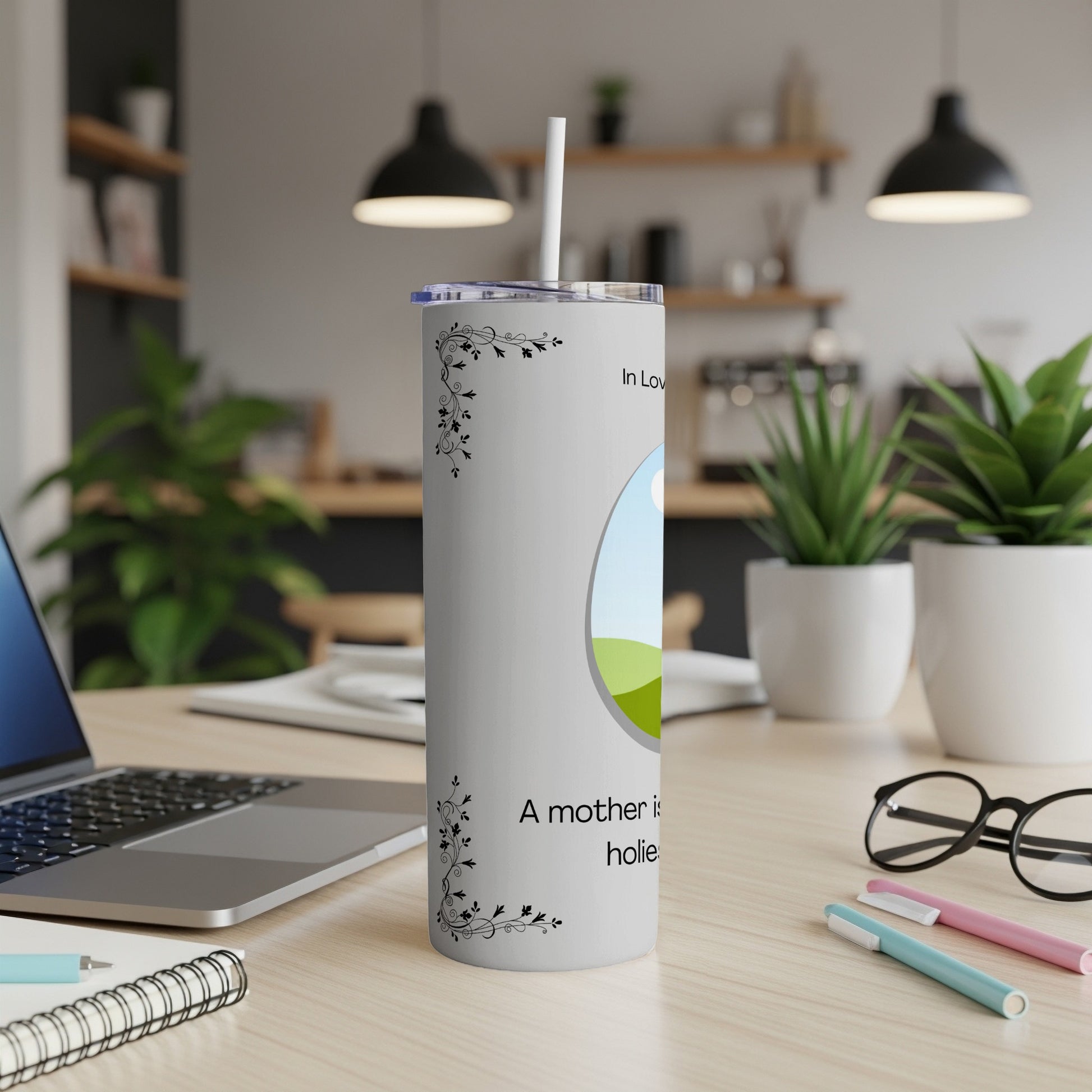 White tumbler with floral design, circle graphic, and "A mother is..." text.
