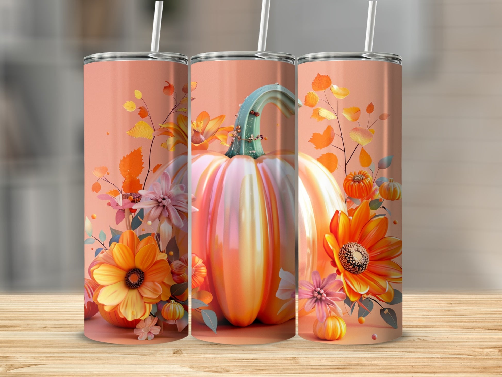 Three tumblers featuring a large pumpkin and fall floral accents.
