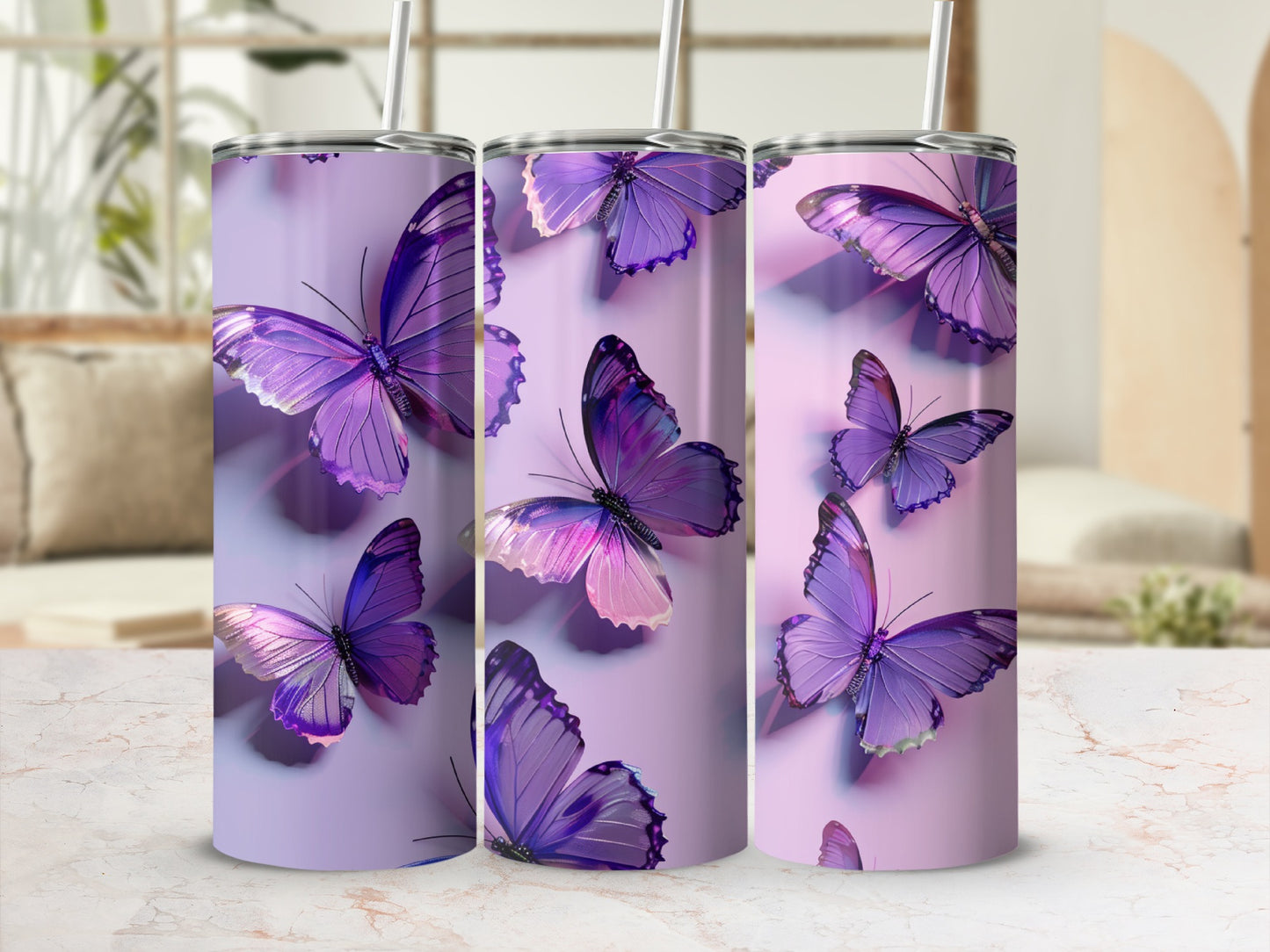 Purple butterflies adorn three tumblers on a marble surface.