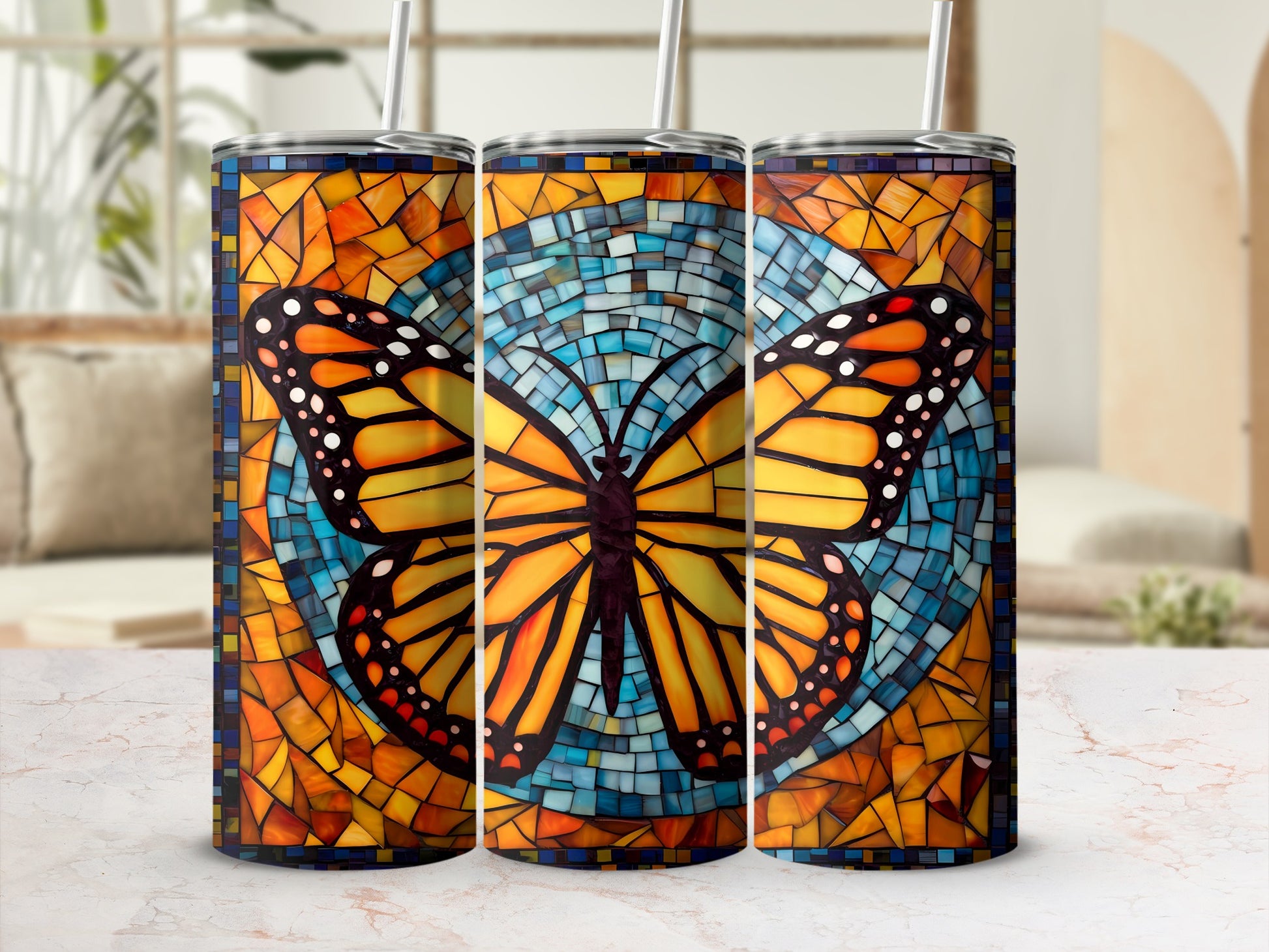 Three tumblers with stained-glass butterfly designs and mosaic tile backgrounds.