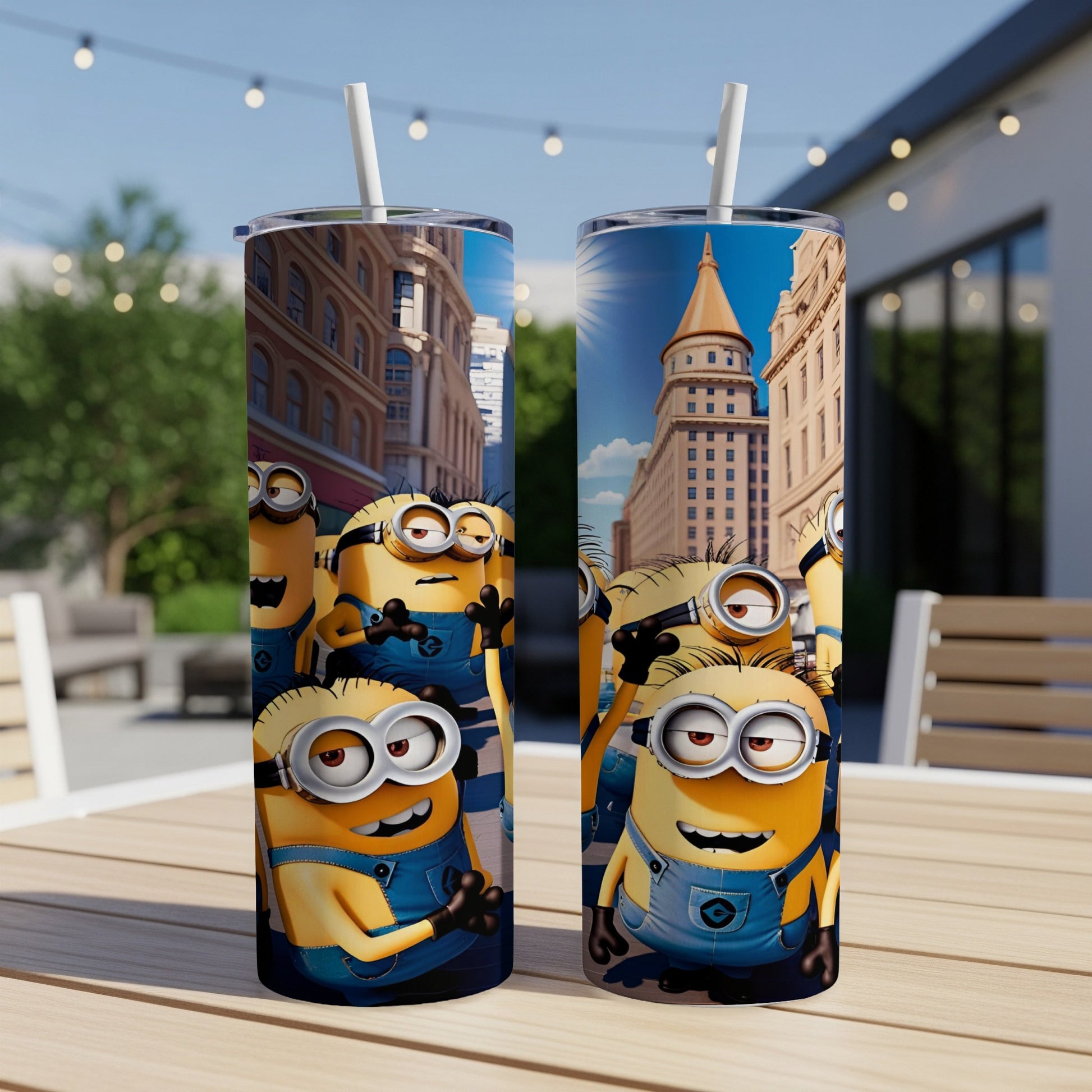 Two Minions tumblers with city background, on a wooden table outdoors.