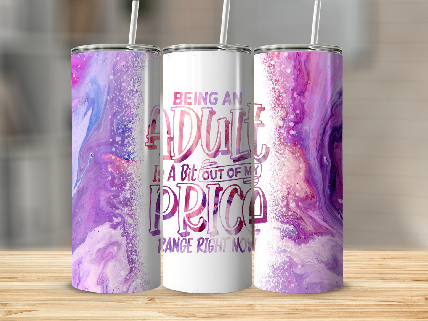 White tumbler with abstract purple and pink design and text: "Being an adult is a bit out of my price range right now."