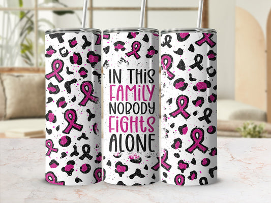Tumbler with pink ribbons, leopard print, and "In this family nobody fights alone" text.