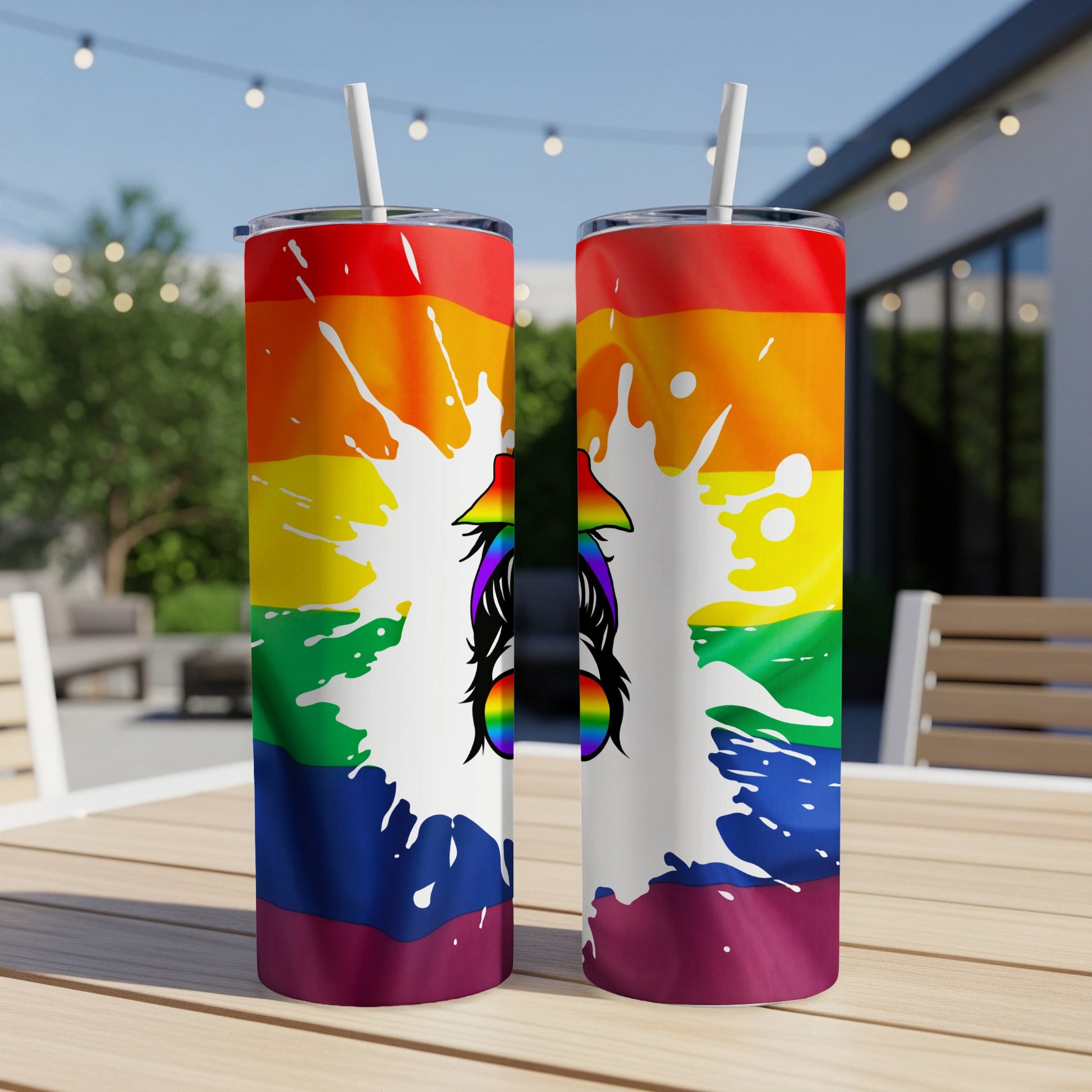 Rainbow pride tumbler with splattered paint and messy bun graphic.