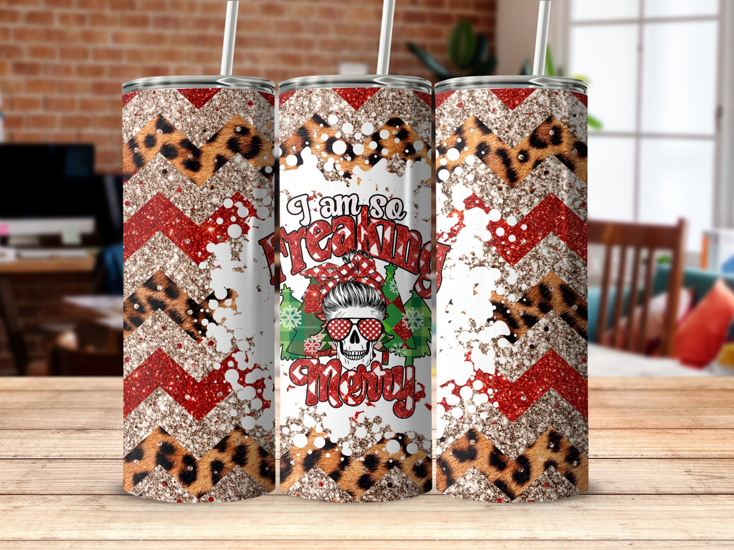 Three tumblers with chevron, leopard print, and sparkly Christmas designs.