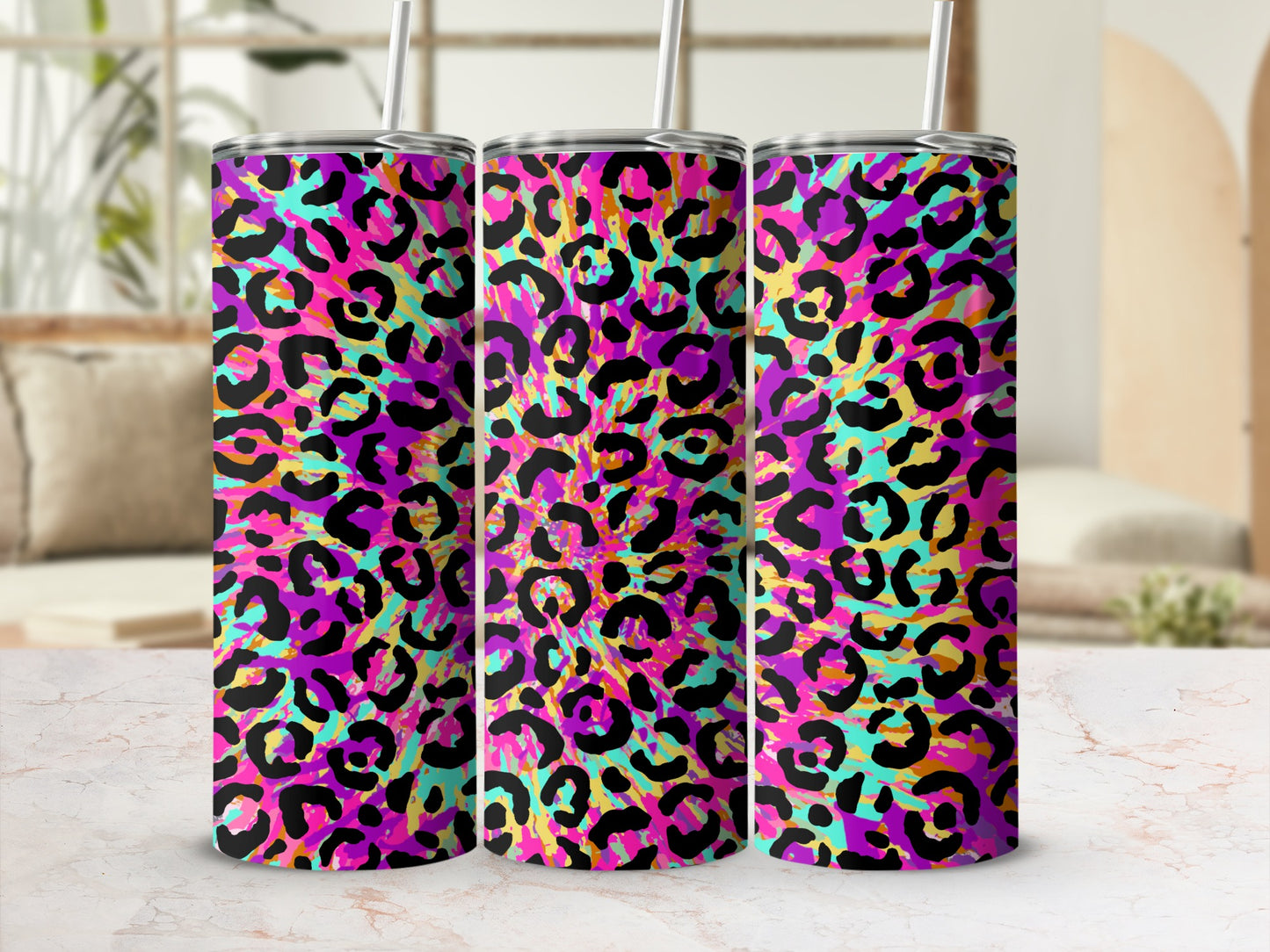 Three tumblers with a vibrant pink, purple, teal, and yellow leopard print design.