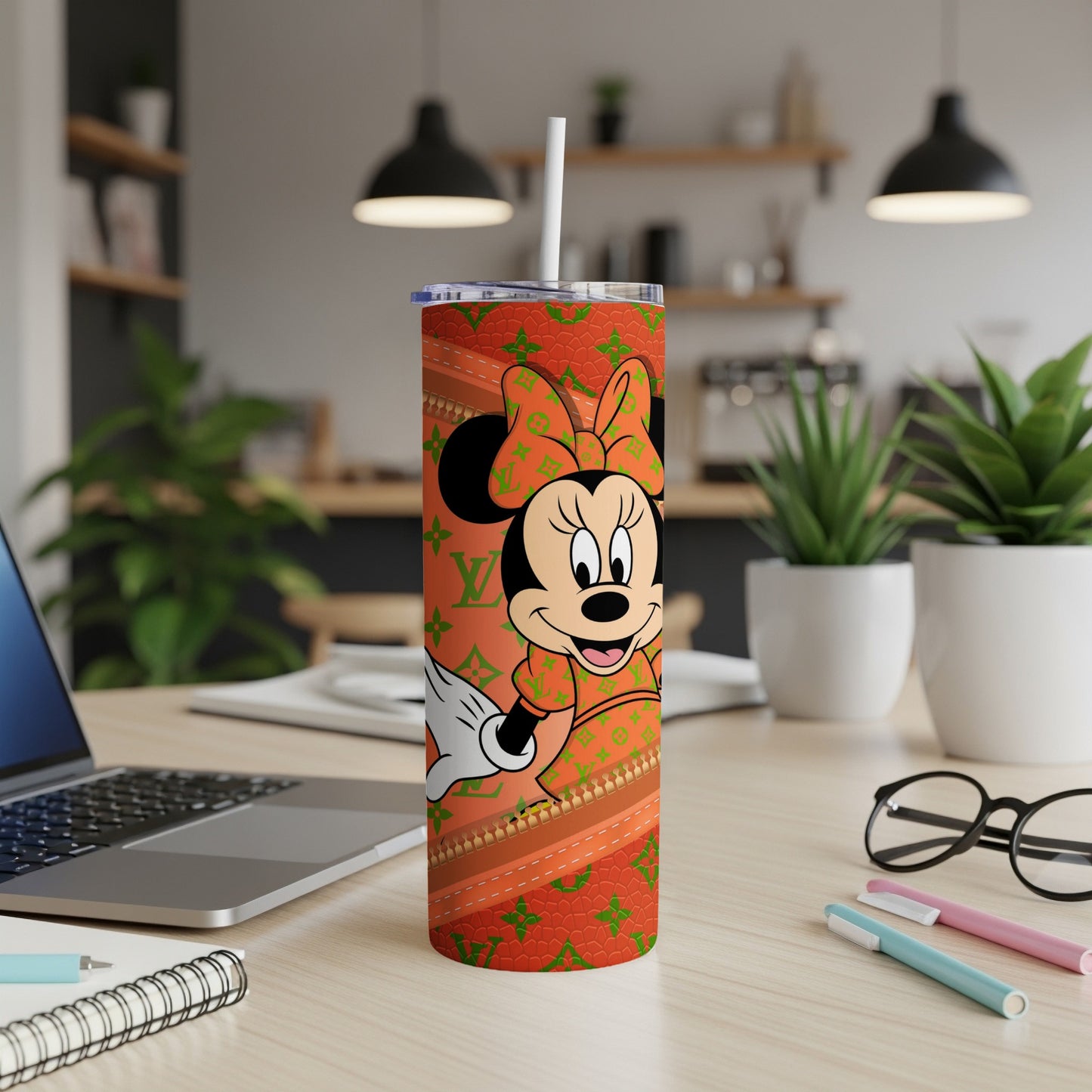 Minnie Mouse on an orange tumbler with repeating LV pattern and straw.