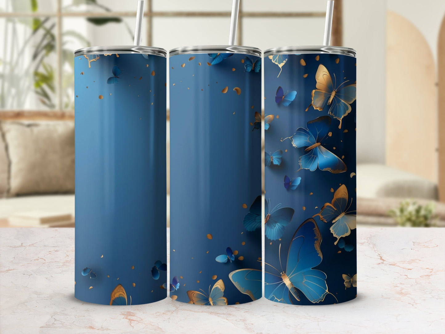 Blue tumbler with gold and blue butterflies and abstract gold accents.