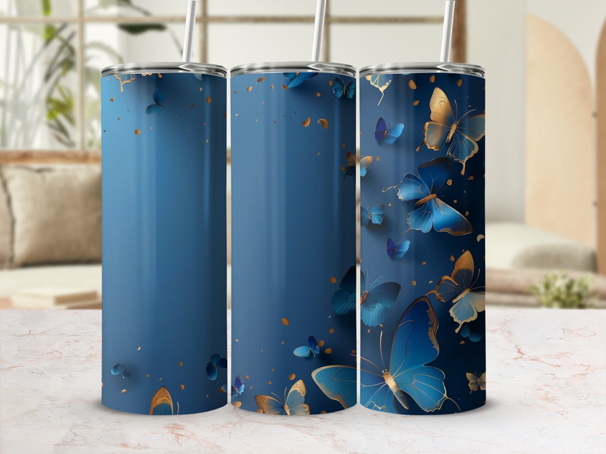 Blue tumbler with gold and blue butterflies and abstract gold accents.