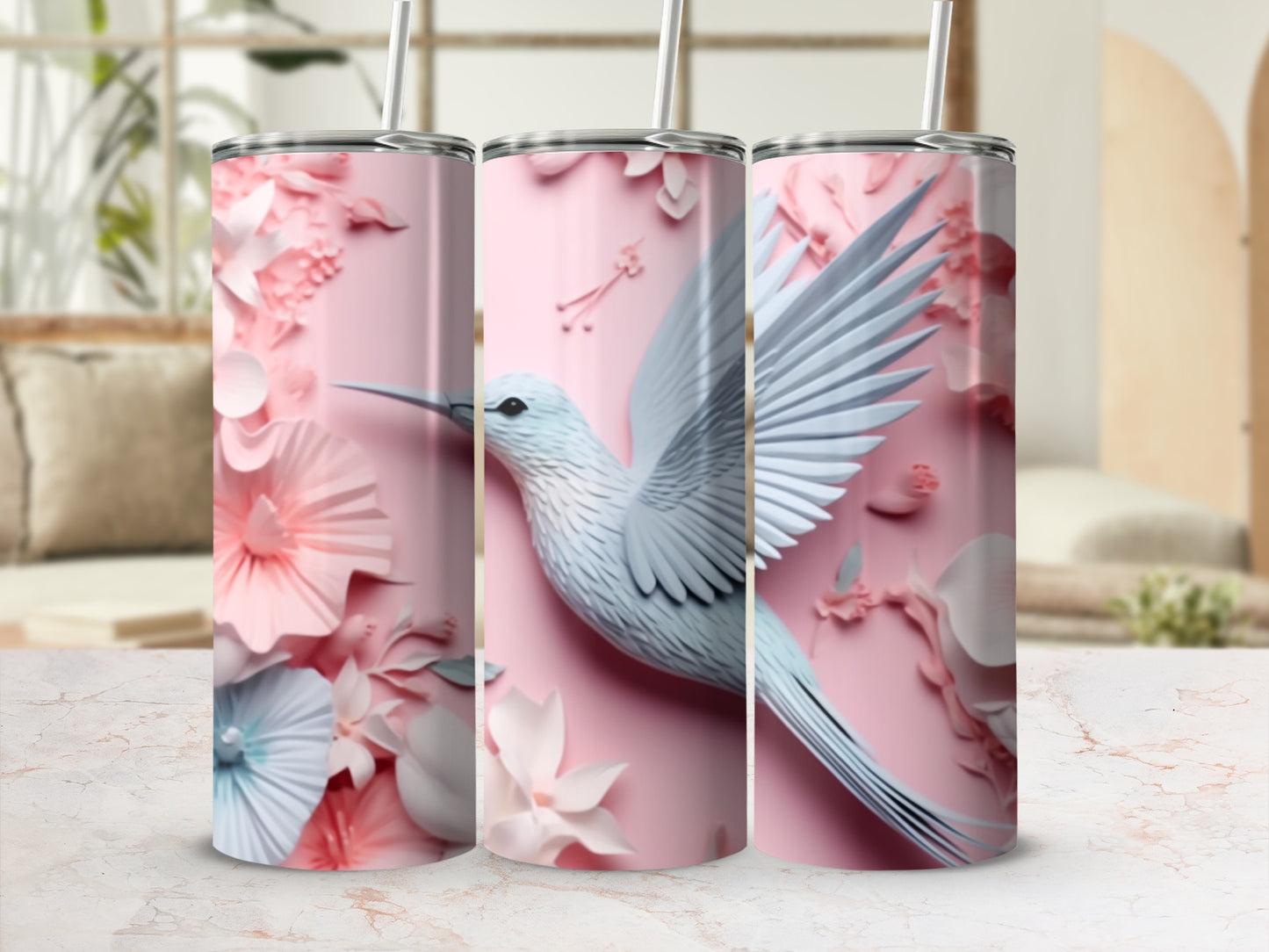 Pink tumbler with white hummingbird and floral accents.