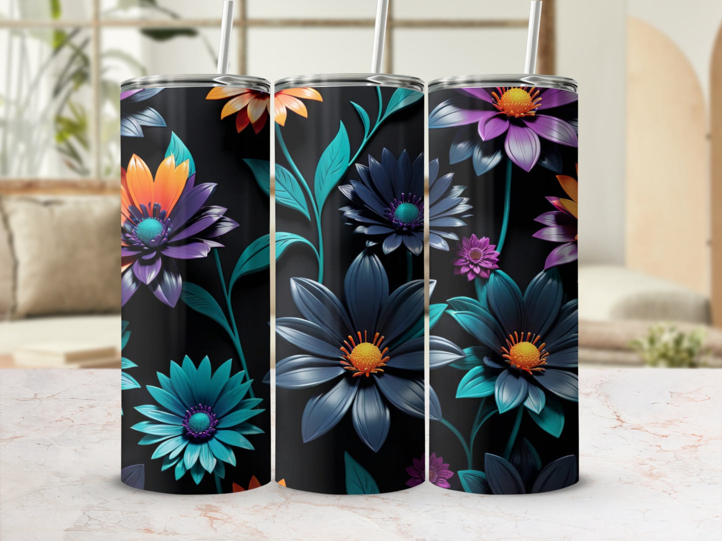 Three black tumblers with colorful floral patterns and straws.