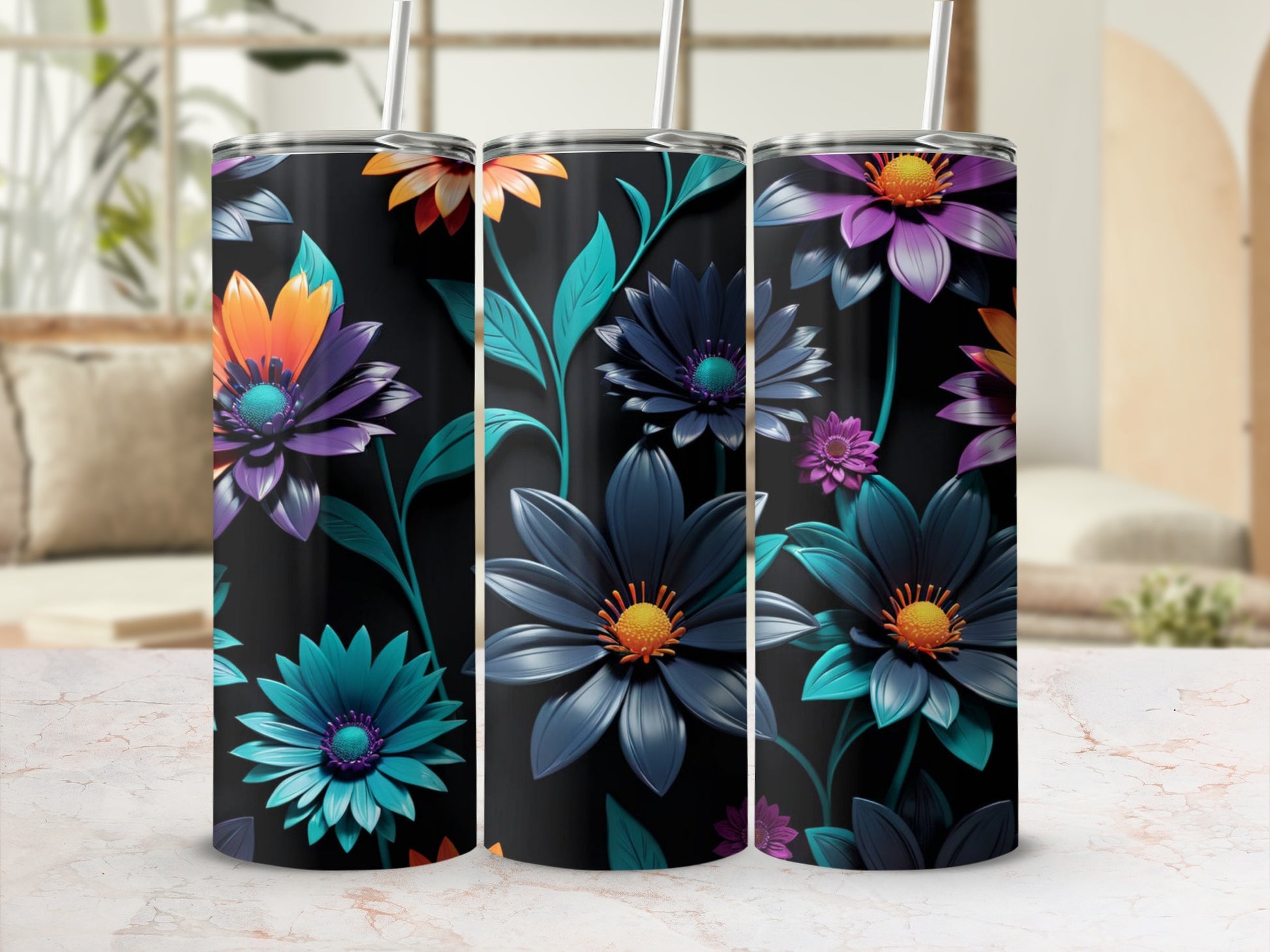 Three black tumblers with colorful floral patterns and straws.
