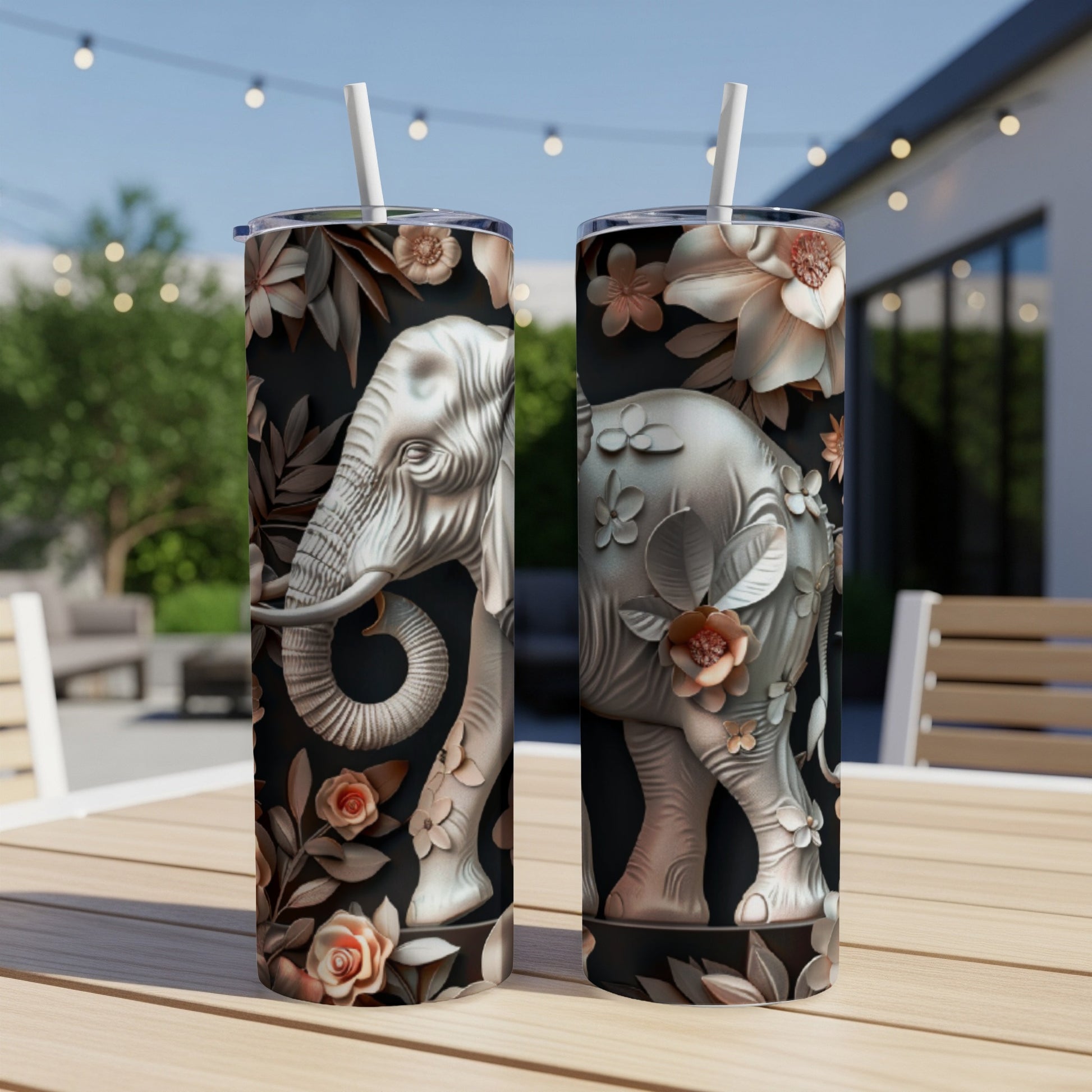 Two tumblers with embossed elephants and floral designs.
