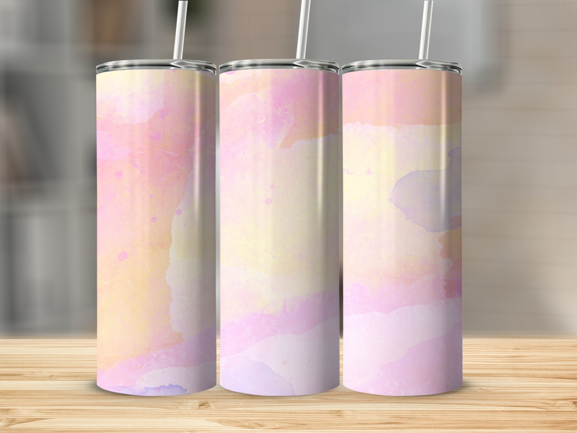 Three tumblers with a pastel watercolor pattern.
