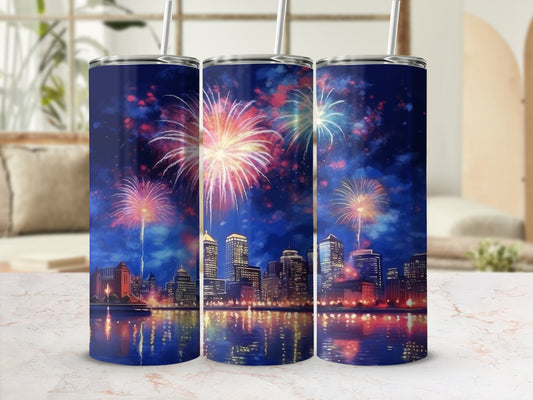 Tumbler with cityscape and colorful fireworks reflected in water.