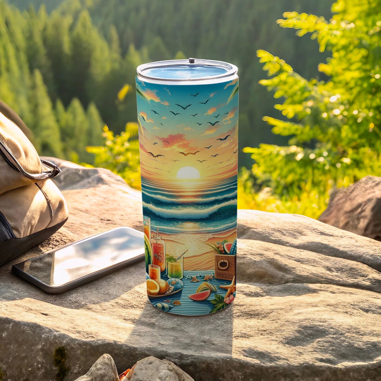 Tumbler with a beach sunset scene featuring waves, fruit, and a picnic basket.