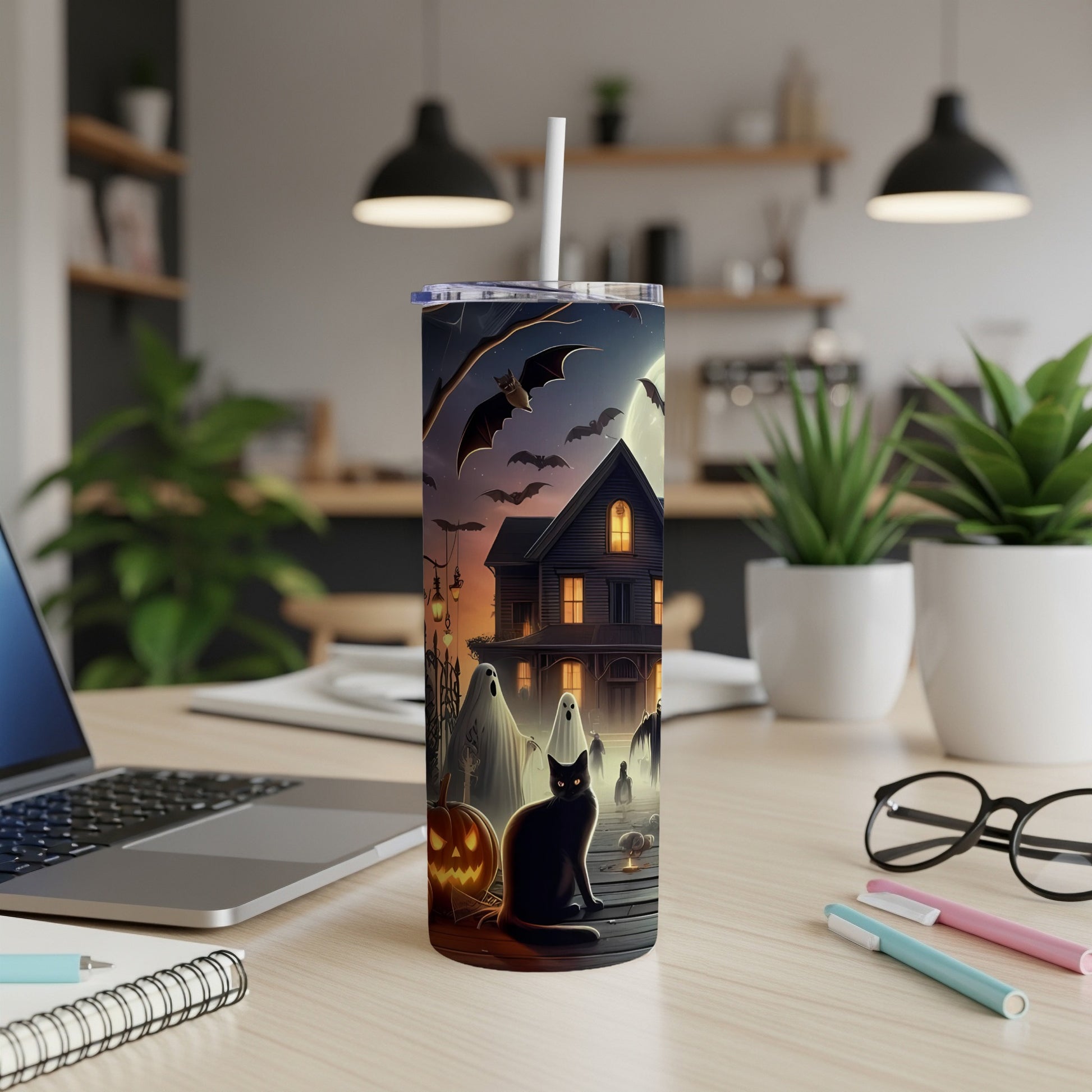 Halloween tumbler with black cat, ghosts, bats, haunted house, and jack-o'-lantern.
