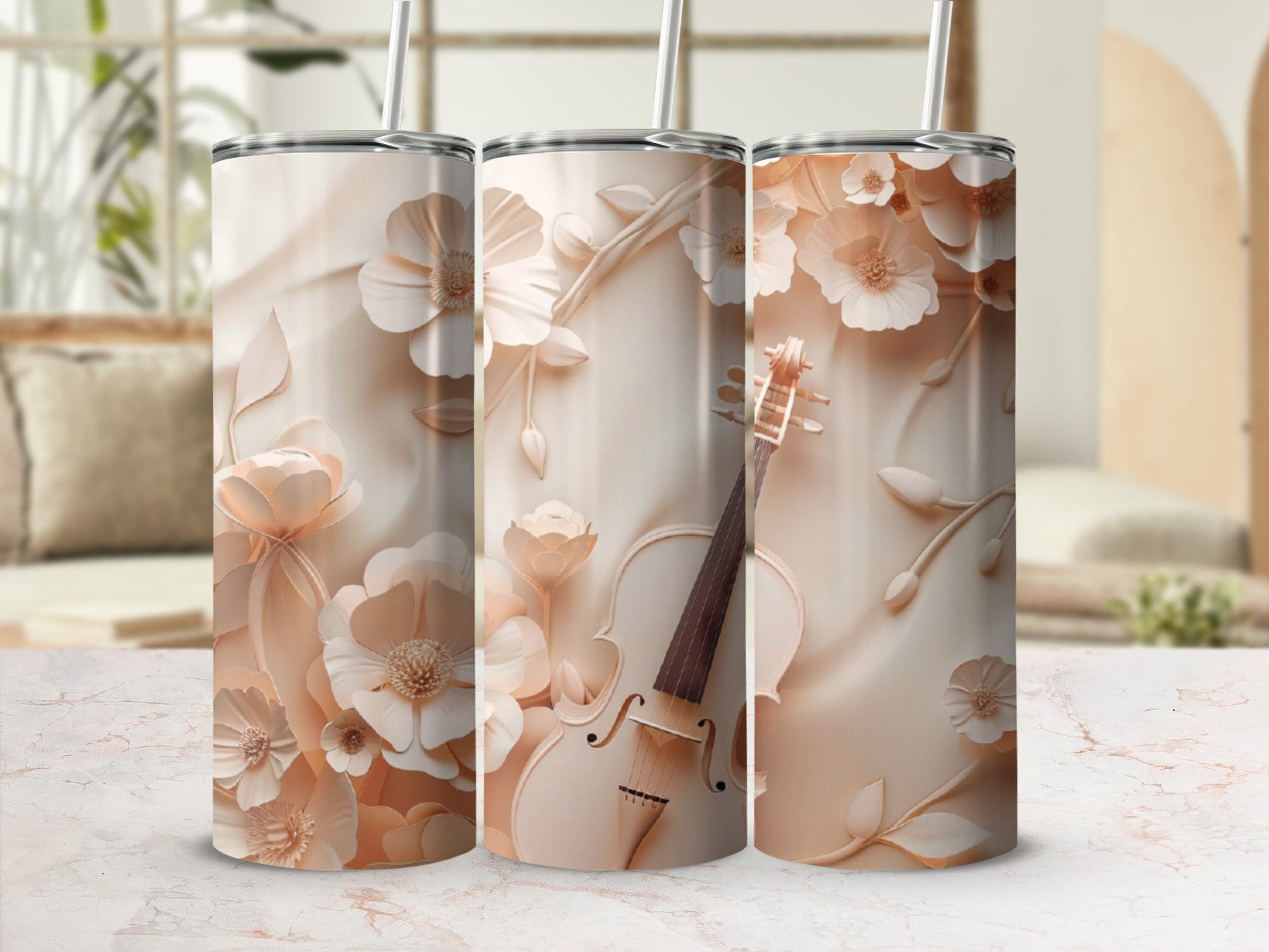 Three tall, narrow tumblers with a floral and violin design in muted pink.