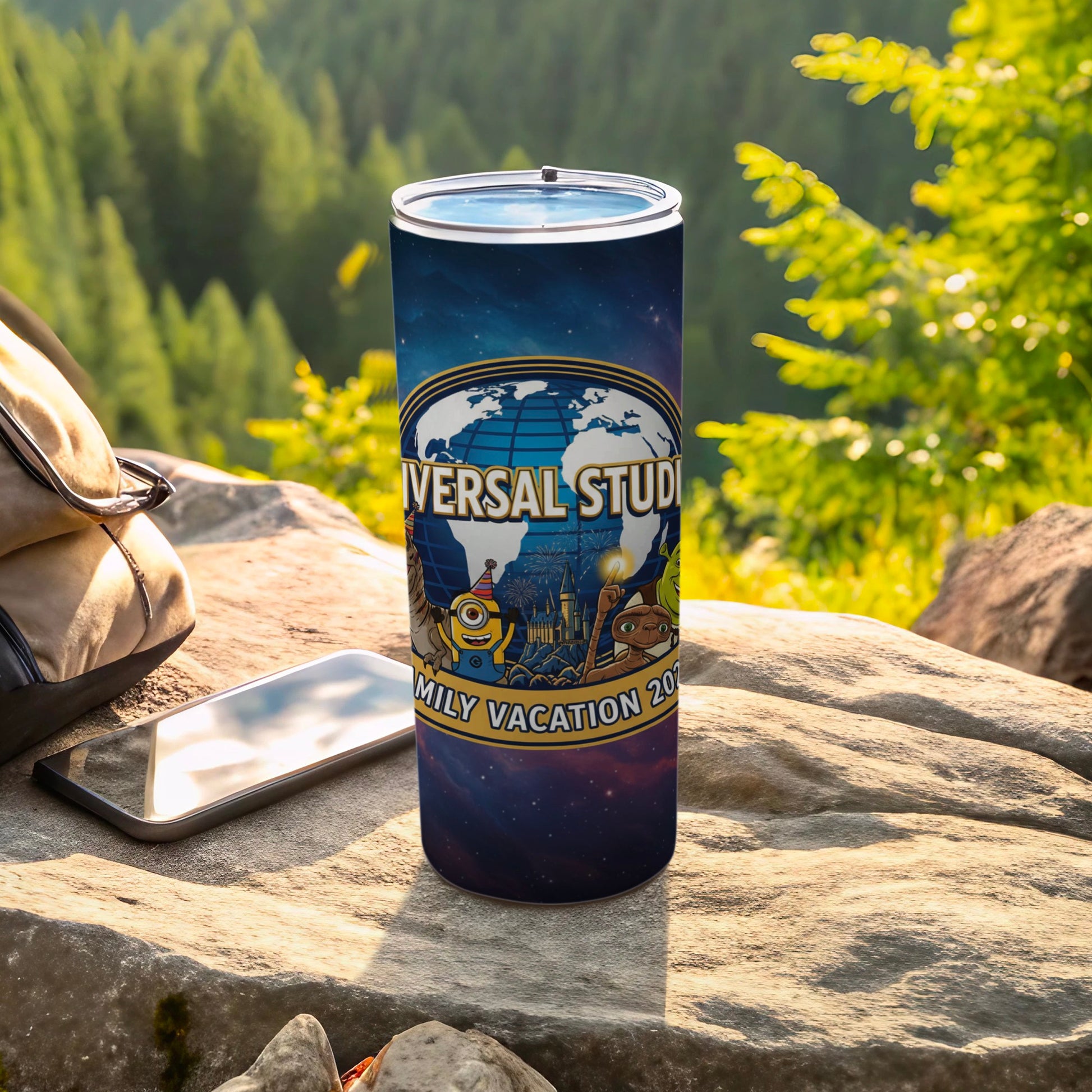 Universal Studios Family Vacation 2023 tumbler with Minions and cartoon characters.