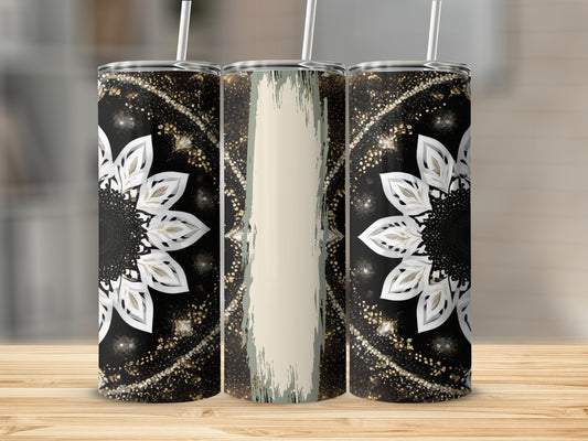 Three tumblers with a black, white, and gold mandala design and straw.