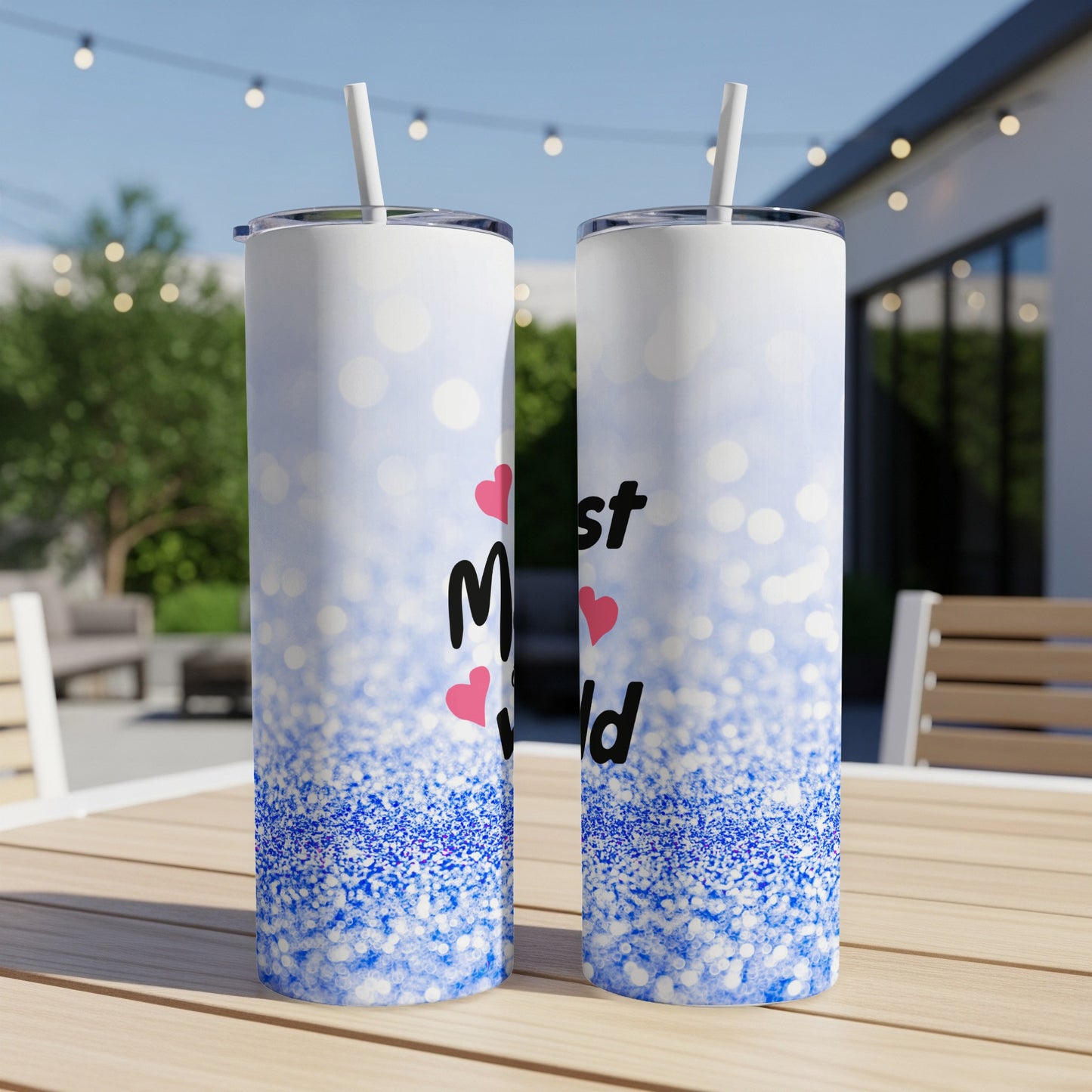 Two skinny tumblers with "Mom" in pink hearts and blue glitter design.