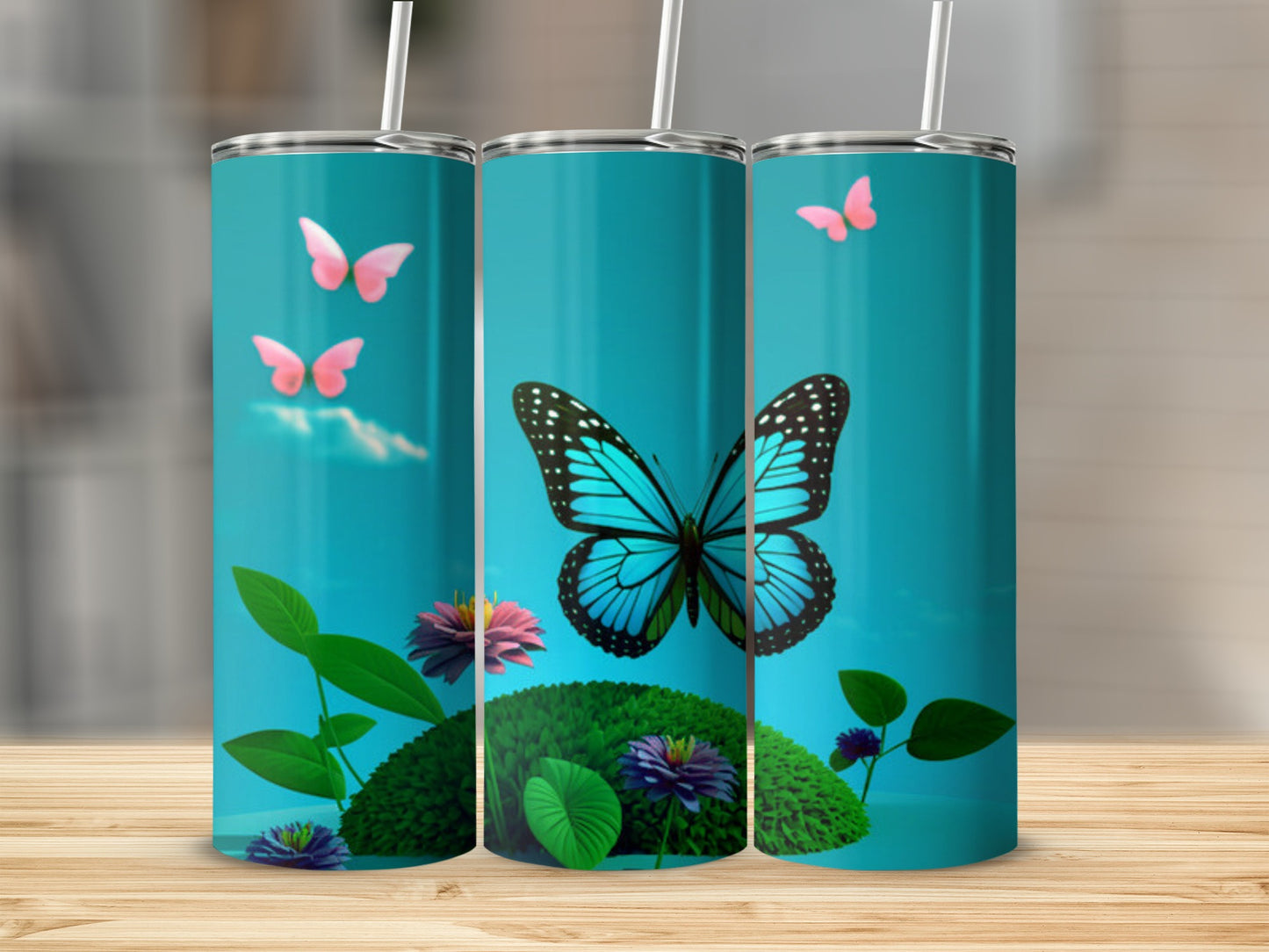 Three blue tumblers featuring a bright blue butterfly and pink butterflies.