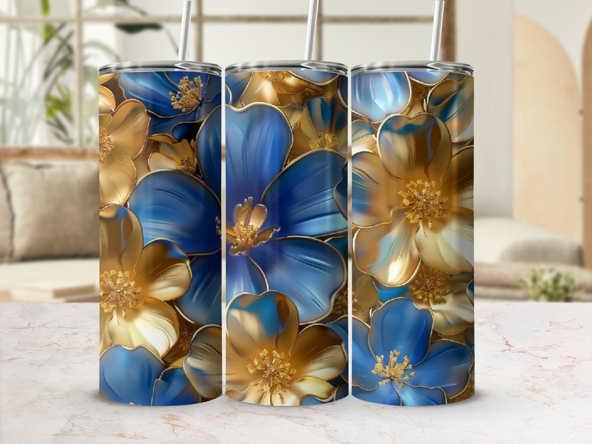 Three tumblers with blue and gold floral pattern.