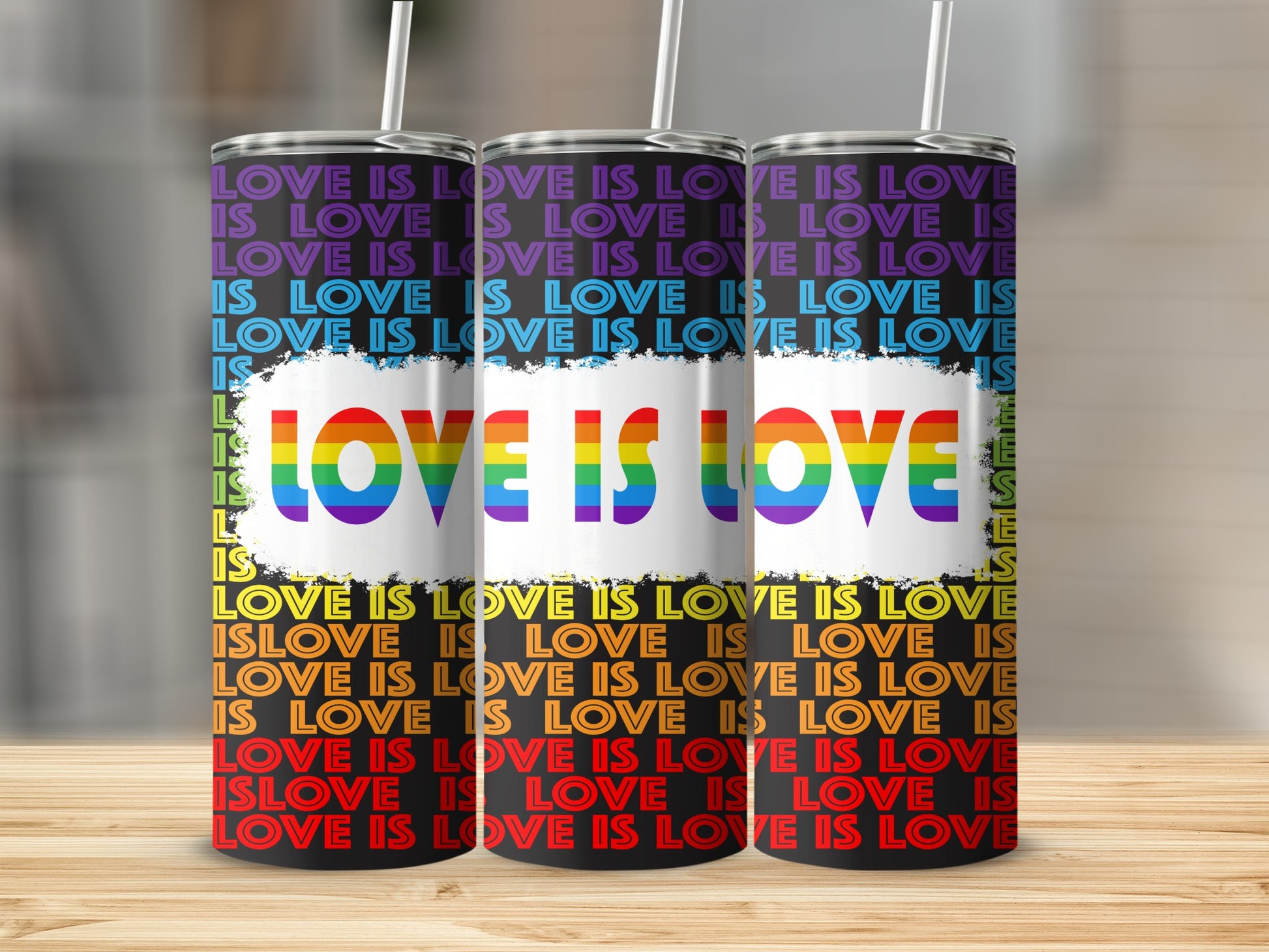Tumbler with rainbow "Love is Love" text pattern.