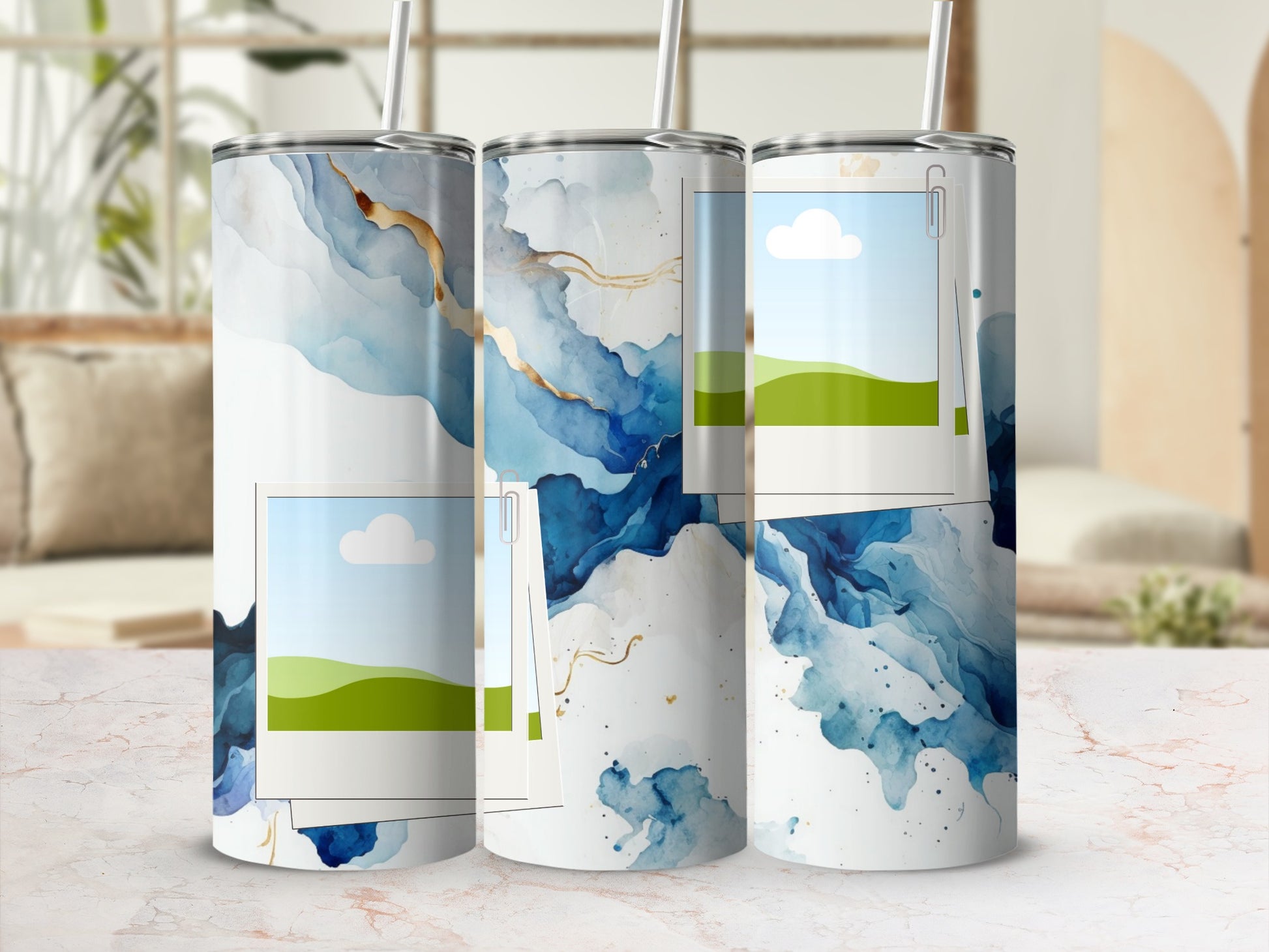 Three tumblers with a blue and gold watercolor design and inlaid polaroid-style images.