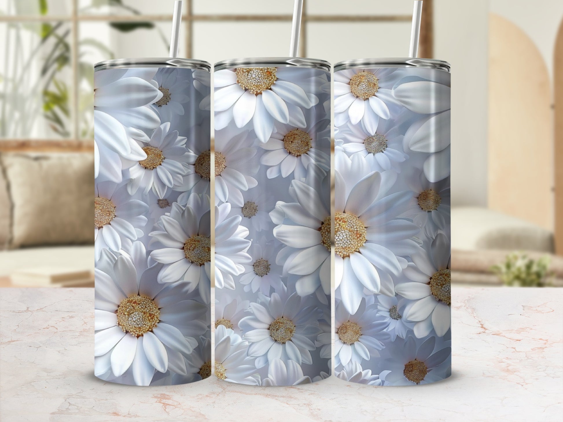 Three tumblers with white daisy floral pattern and straws.