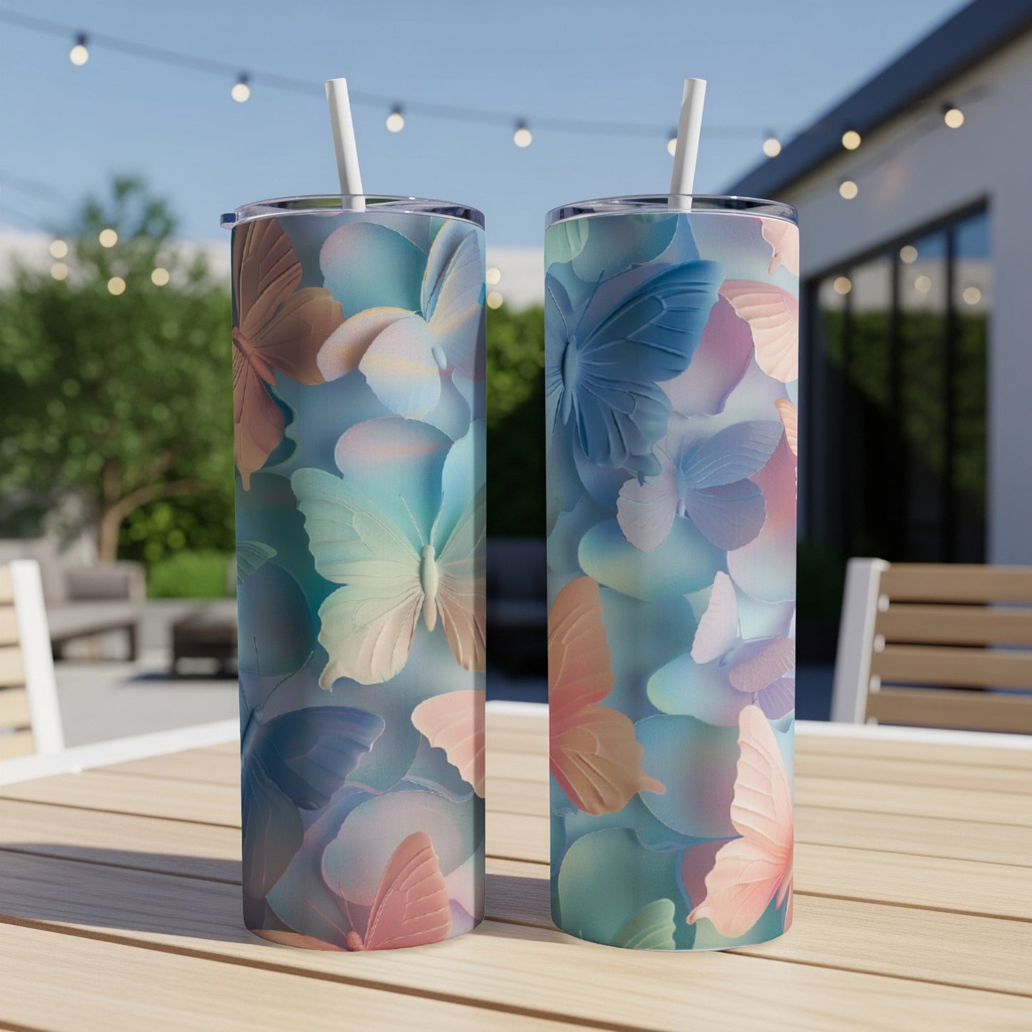 Two tall, skinny tumblers with a pastel butterfly pattern.