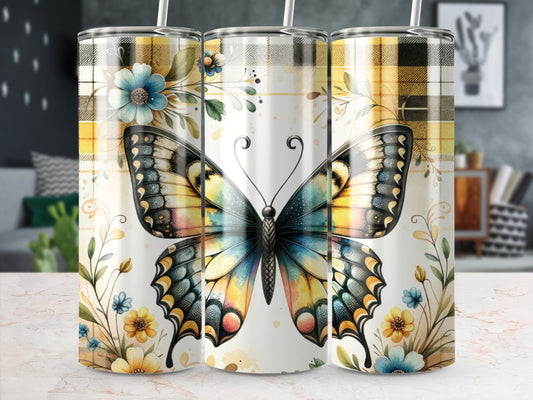 Butterfly and floral design on a patterned tumbler.